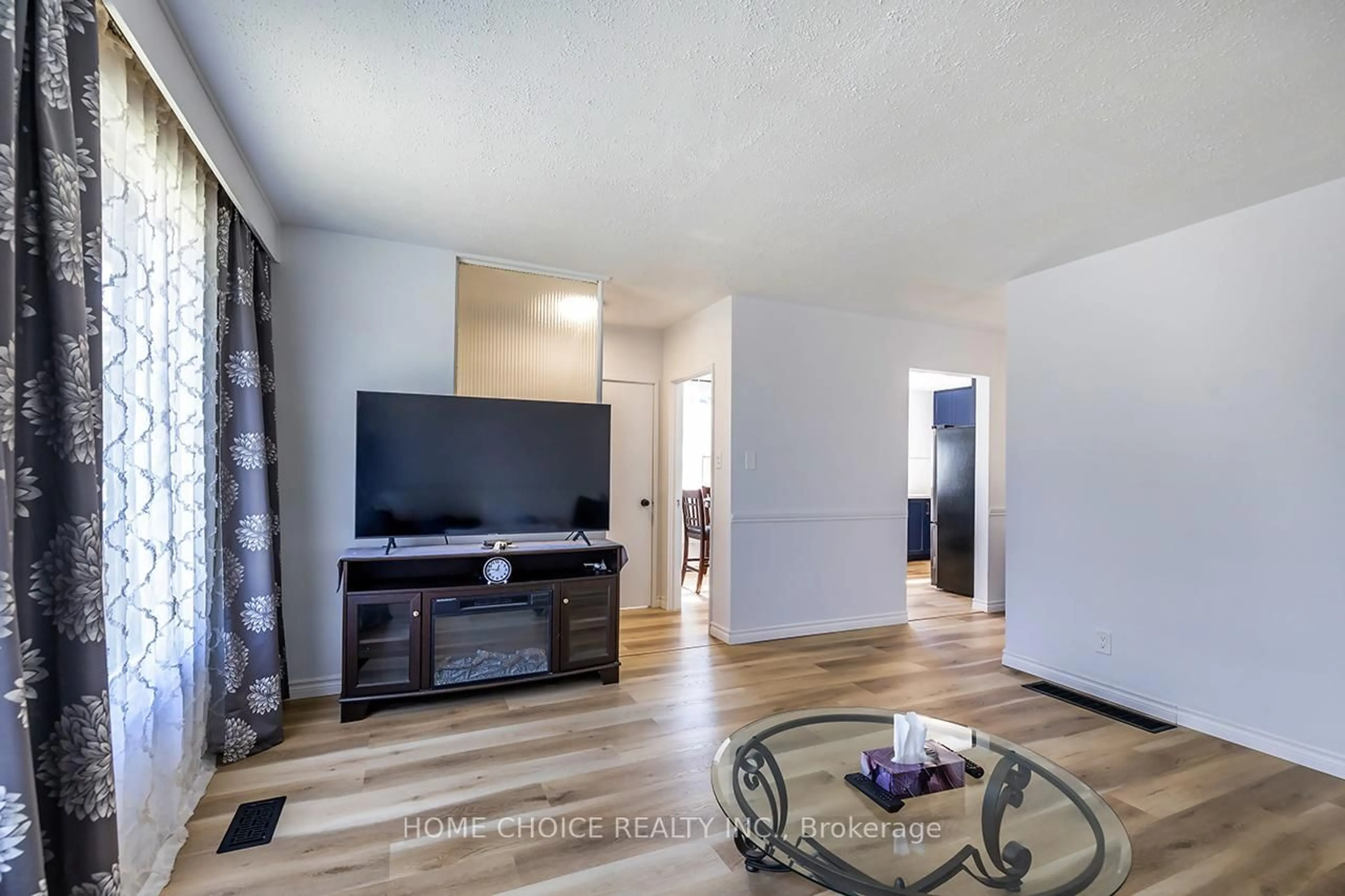 Living room with furniture, wood/laminate floor for 1014 Centre St, Whitby Ontario L1N 4V3