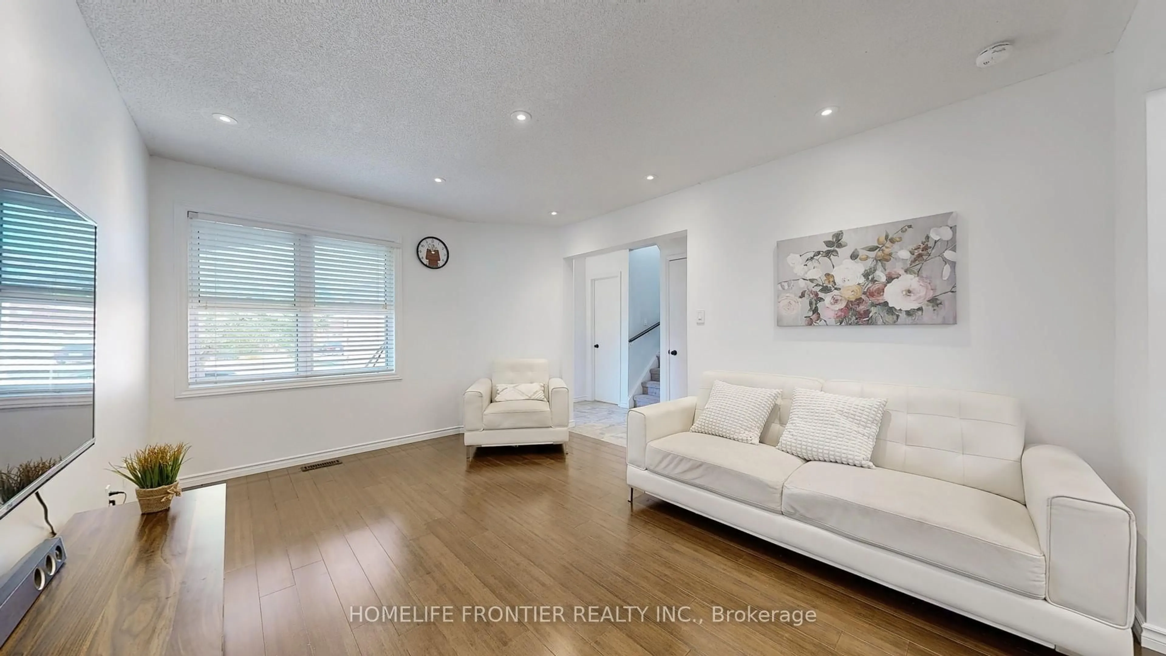 Living room with furniture, wood/laminate floor for 1644 Holly Hedge Dr, Pickering Ontario L1X 2G2