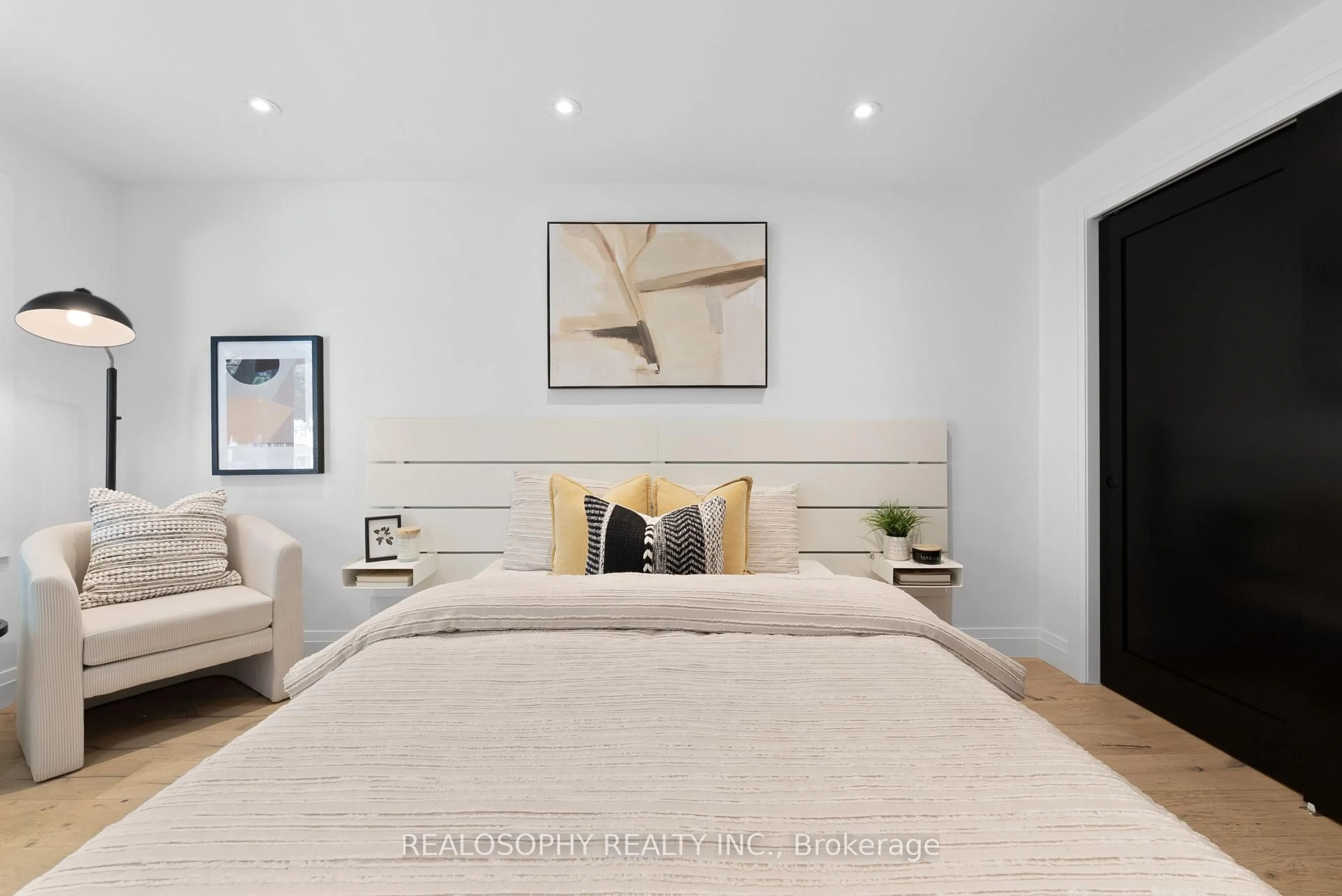 Bedroom with bed, wood/laminate floor for 69 Wallington Ave, Toronto Ontario M4C 2N2