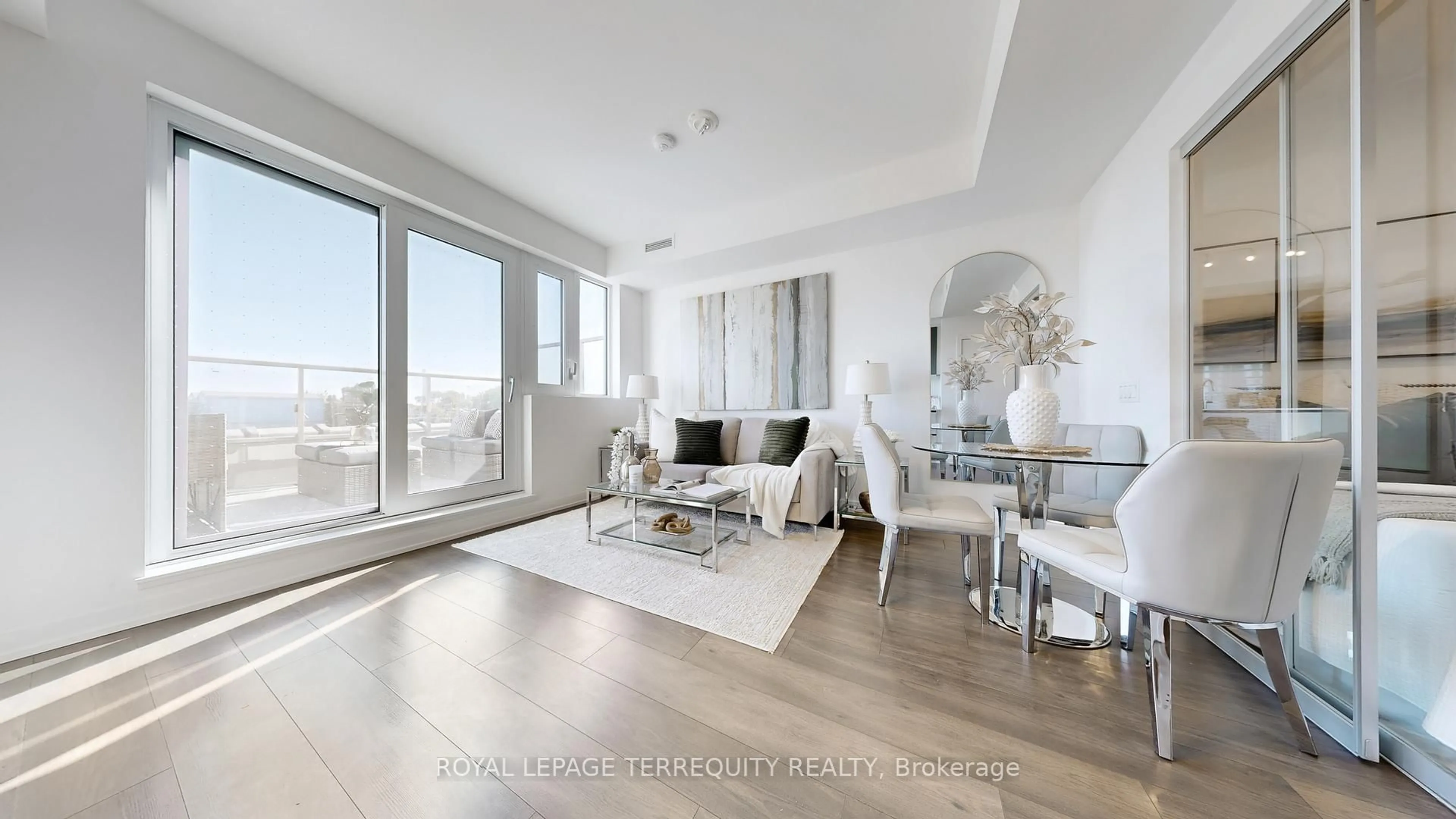 Living room with furniture, wood/laminate floor for 150 Logan Ave #447, Toronto Ontario M4M 0E4