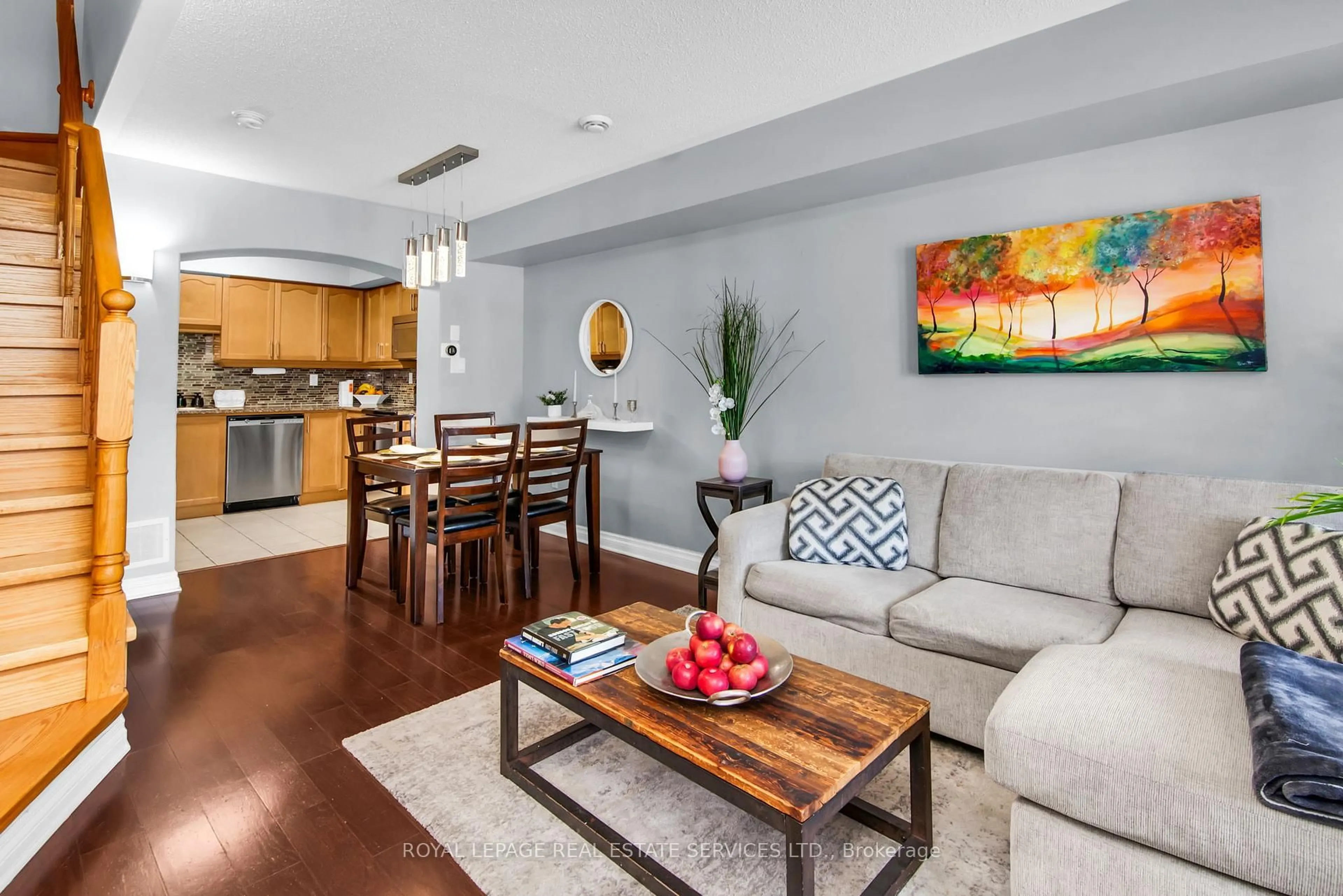 Living room with furniture, wood/laminate floor for 6 Tranter Tr, Toronto Ontario M1L 0G6