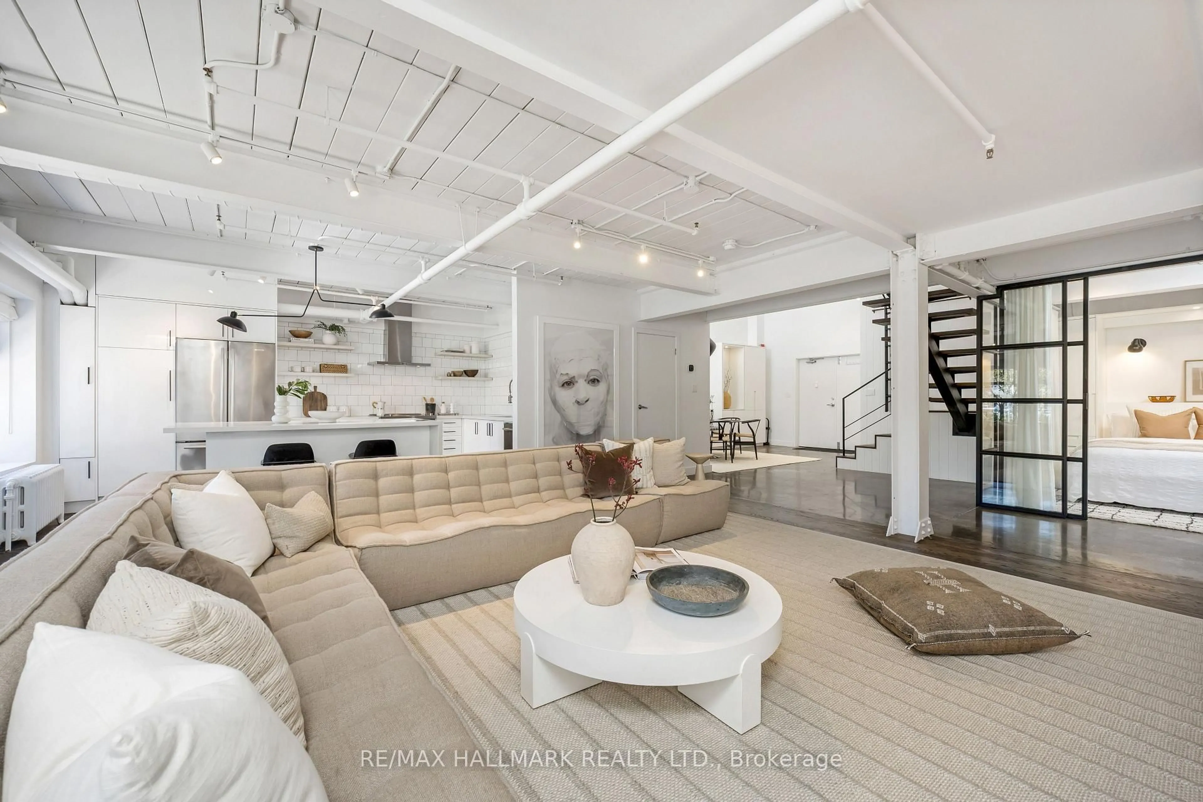 Living room with furniture, unknown for 326 Carlaw Ave #102, Toronto Ontario M4M 3N8