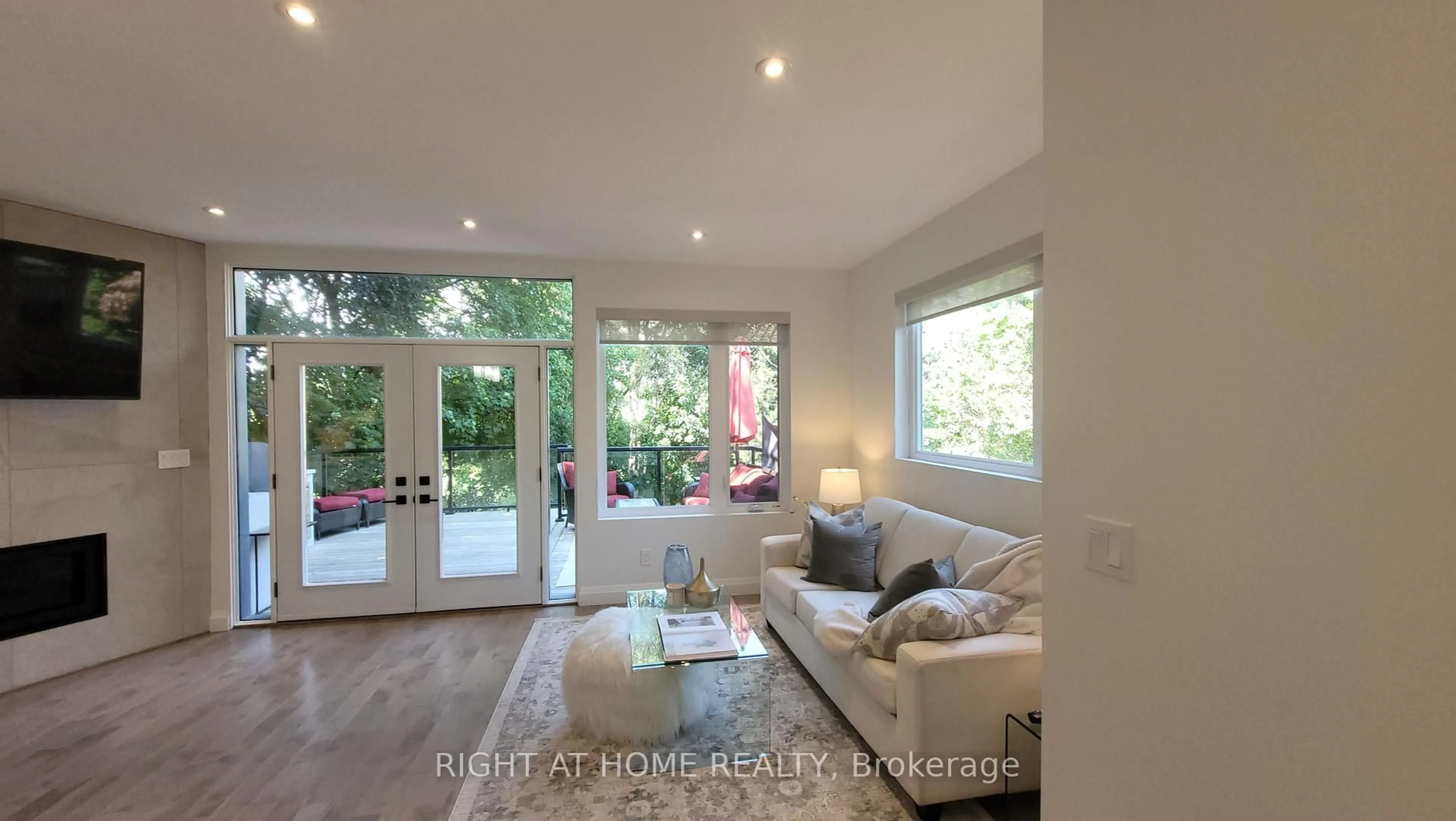 Living room with furniture, wood/laminate floor for 475 Donlands Ave, Toronto Ontario M4J 3S4