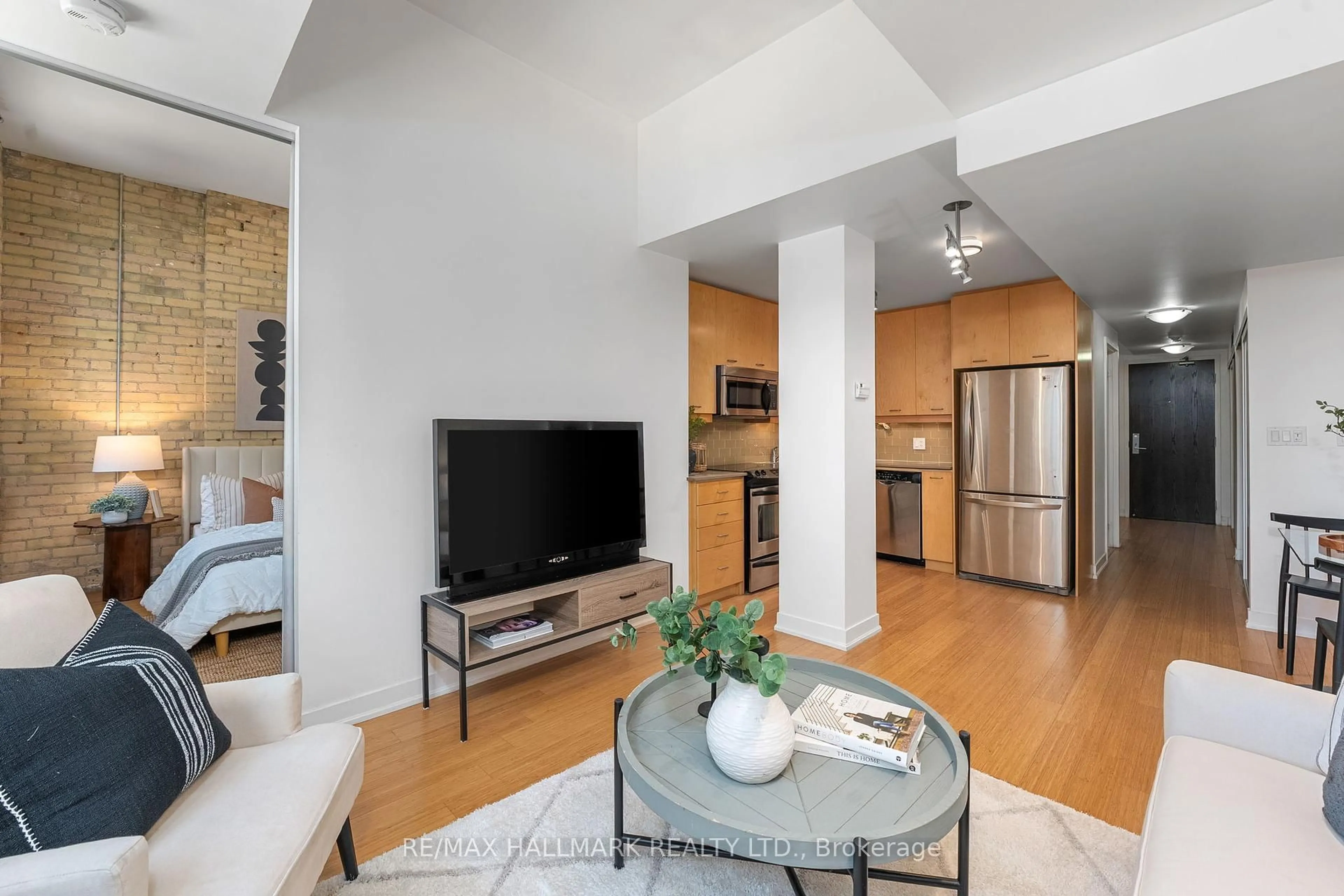 Living room with furniture, unknown for 201 Carlaw Ave #239, Toronto Ontario M4M 2S1