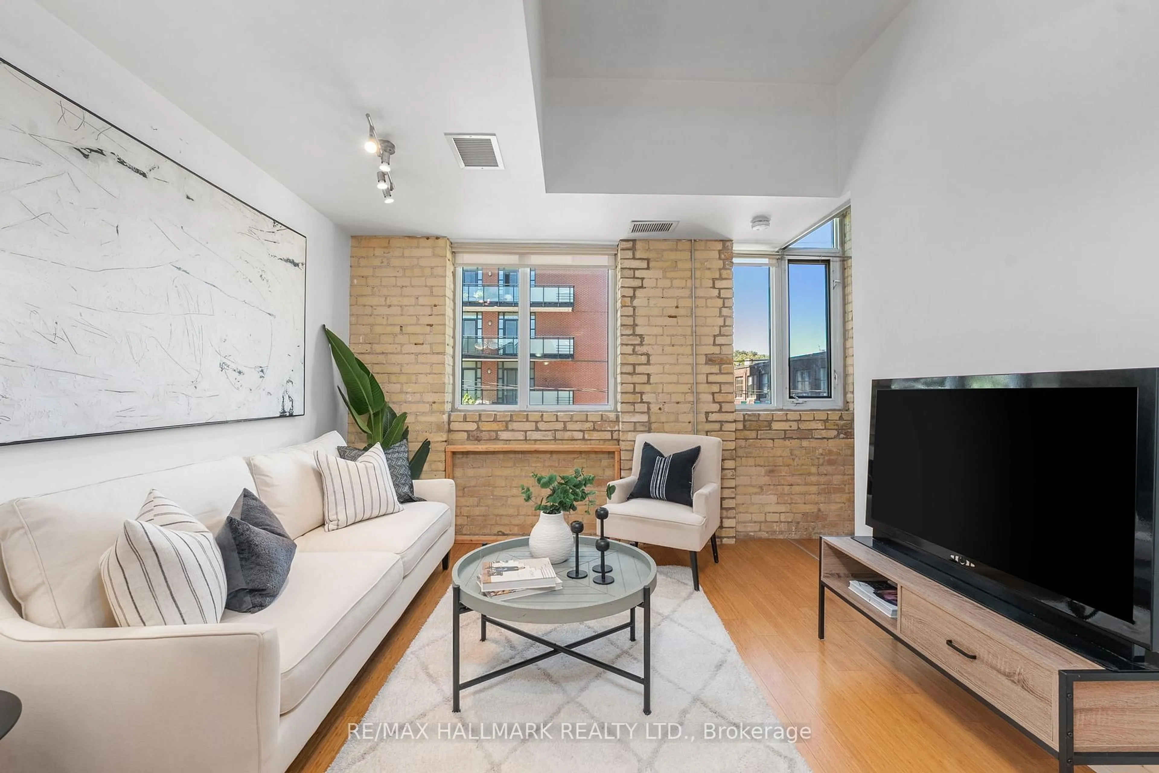 Living room with furniture, unknown for 201 Carlaw Ave #239, Toronto Ontario M4M 2S1