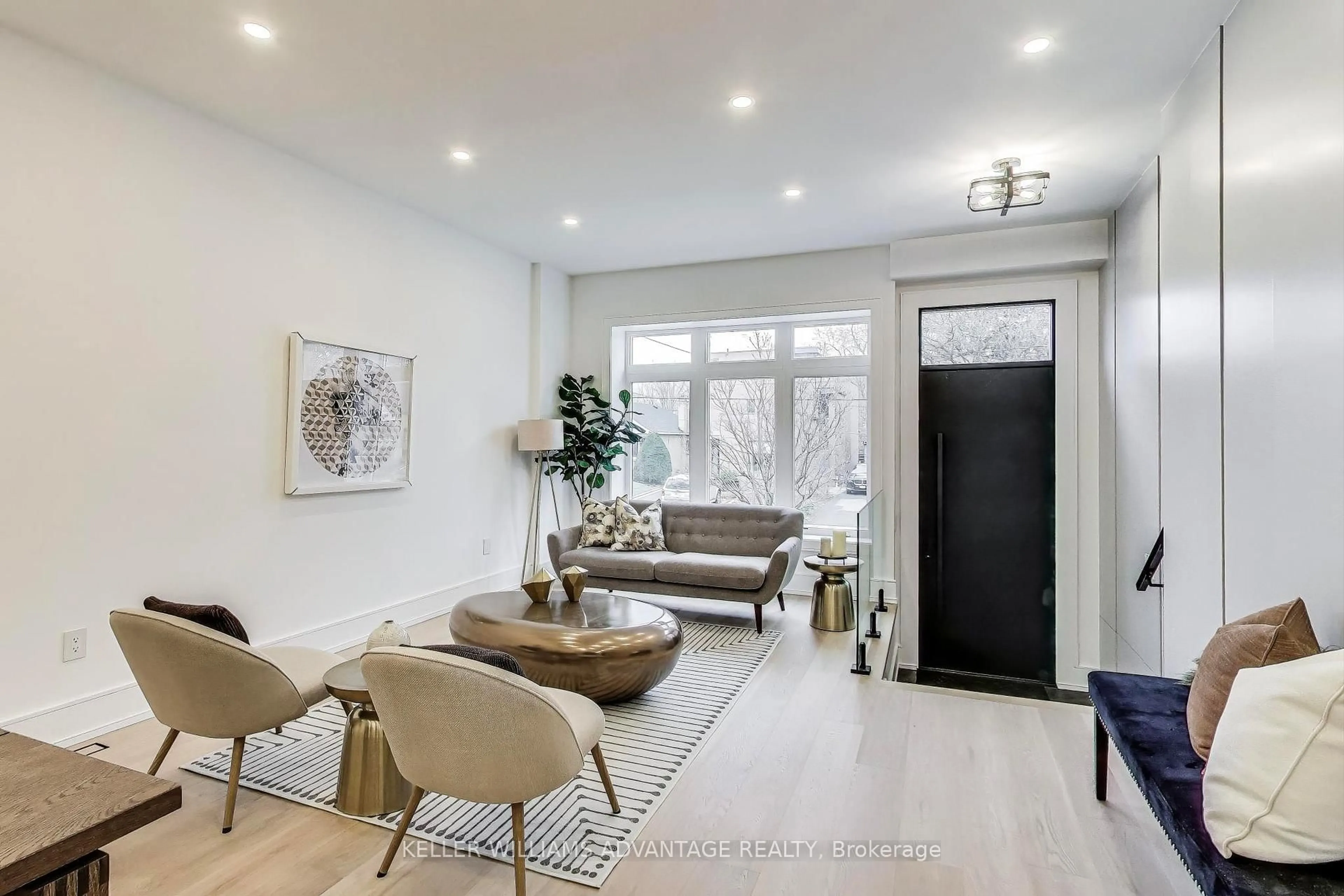 Living room with furniture, wood/laminate floor for 36 Doris Dr, Toronto Ontario M4B 3C8