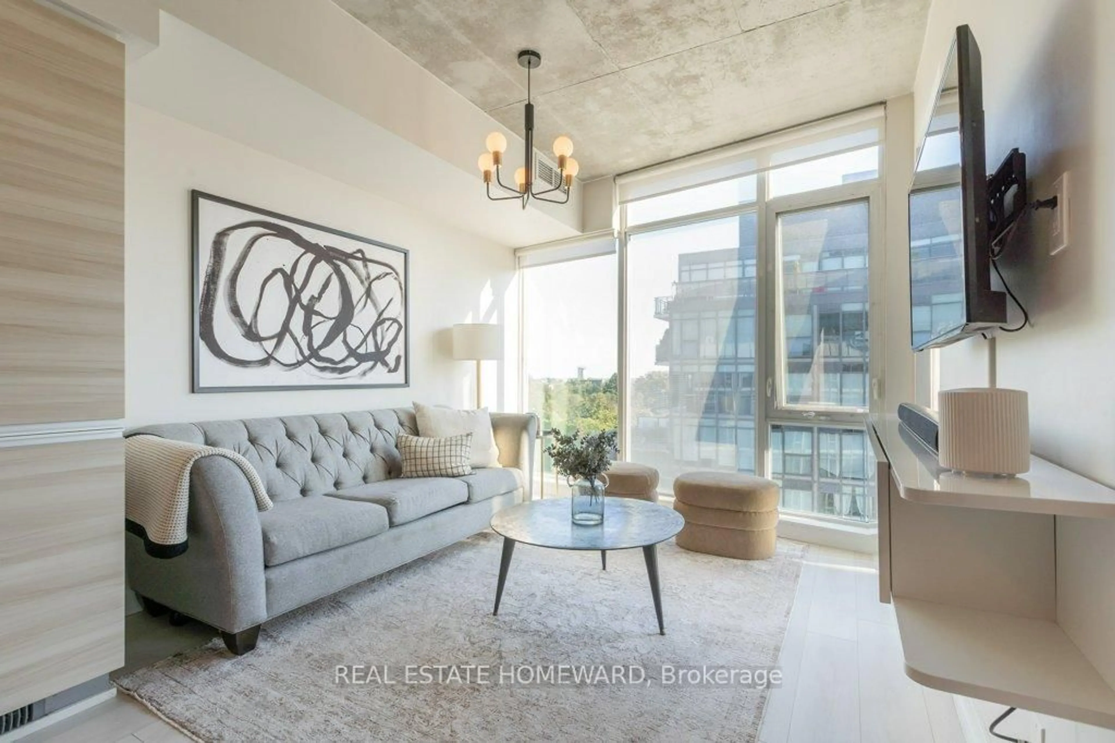 Living room with furniture, cement floor for 1190 Dundas St #809, Toronto Ontario M4M 0C5