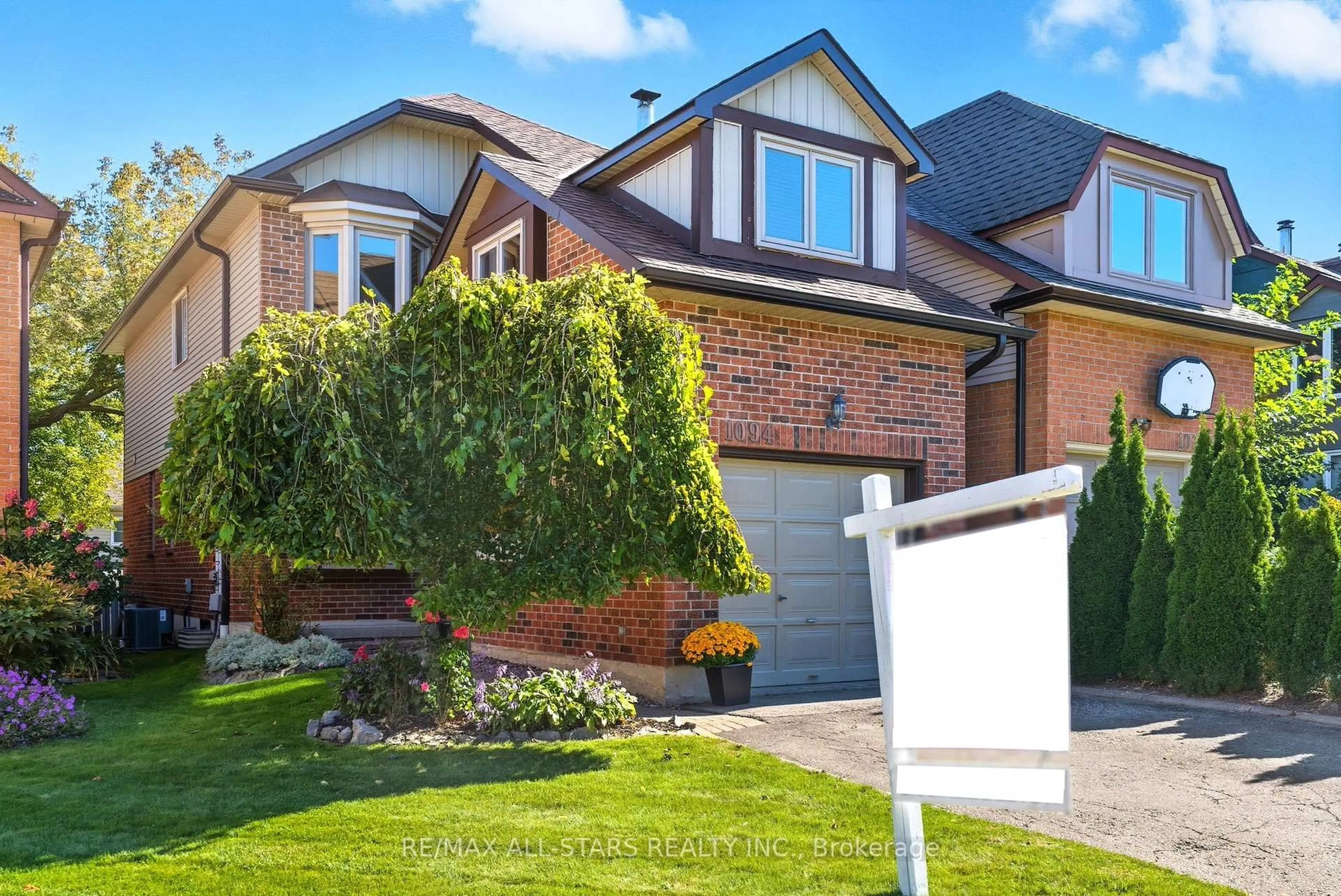 Home with brick exterior material, street for 1094 Longbow Dr, Pickering Ontario L1V 5X3