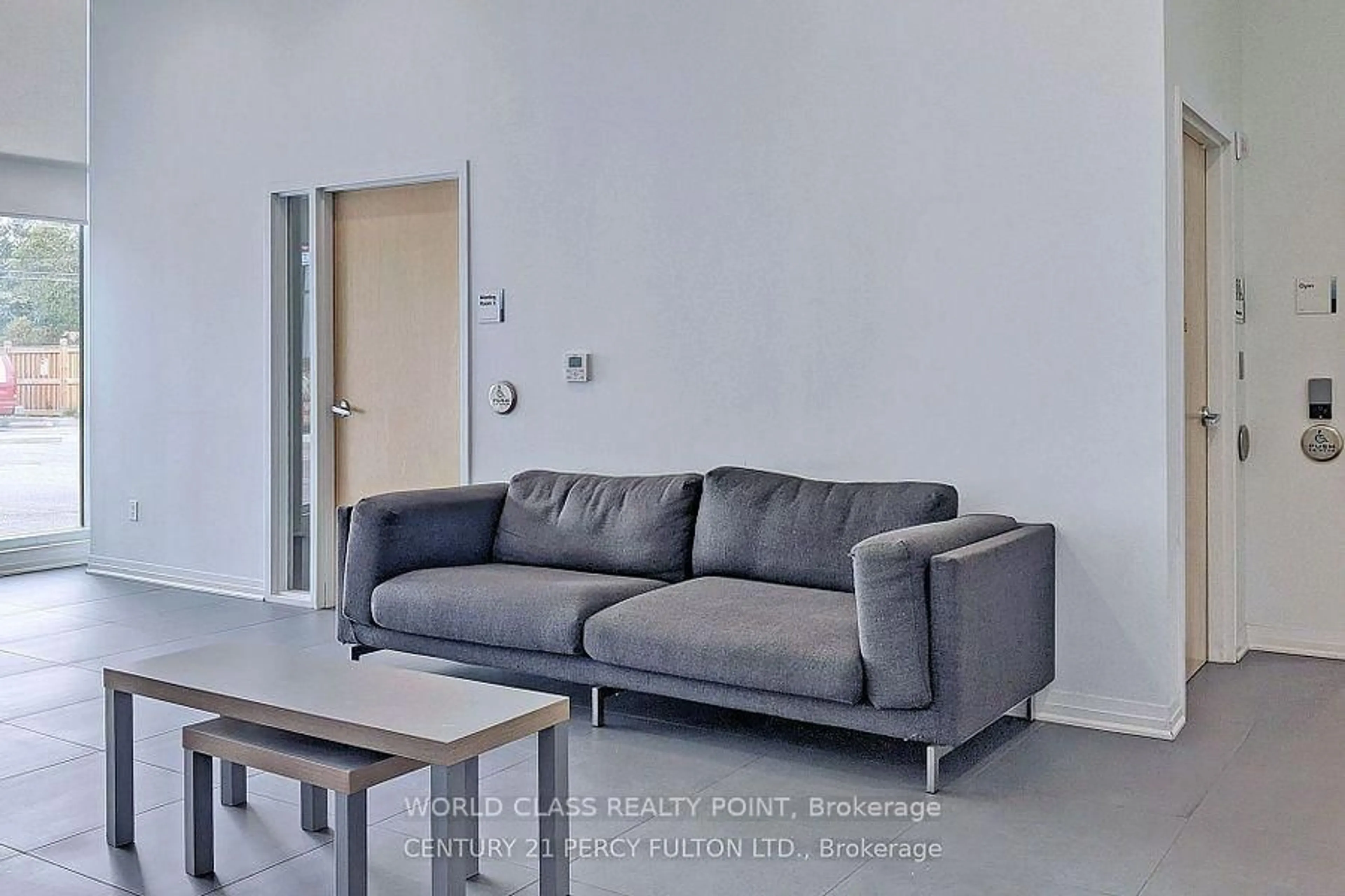 Living room with furniture, cement floor for 1900 Simcoe St #633, Oshawa Ontario L1G 0C1