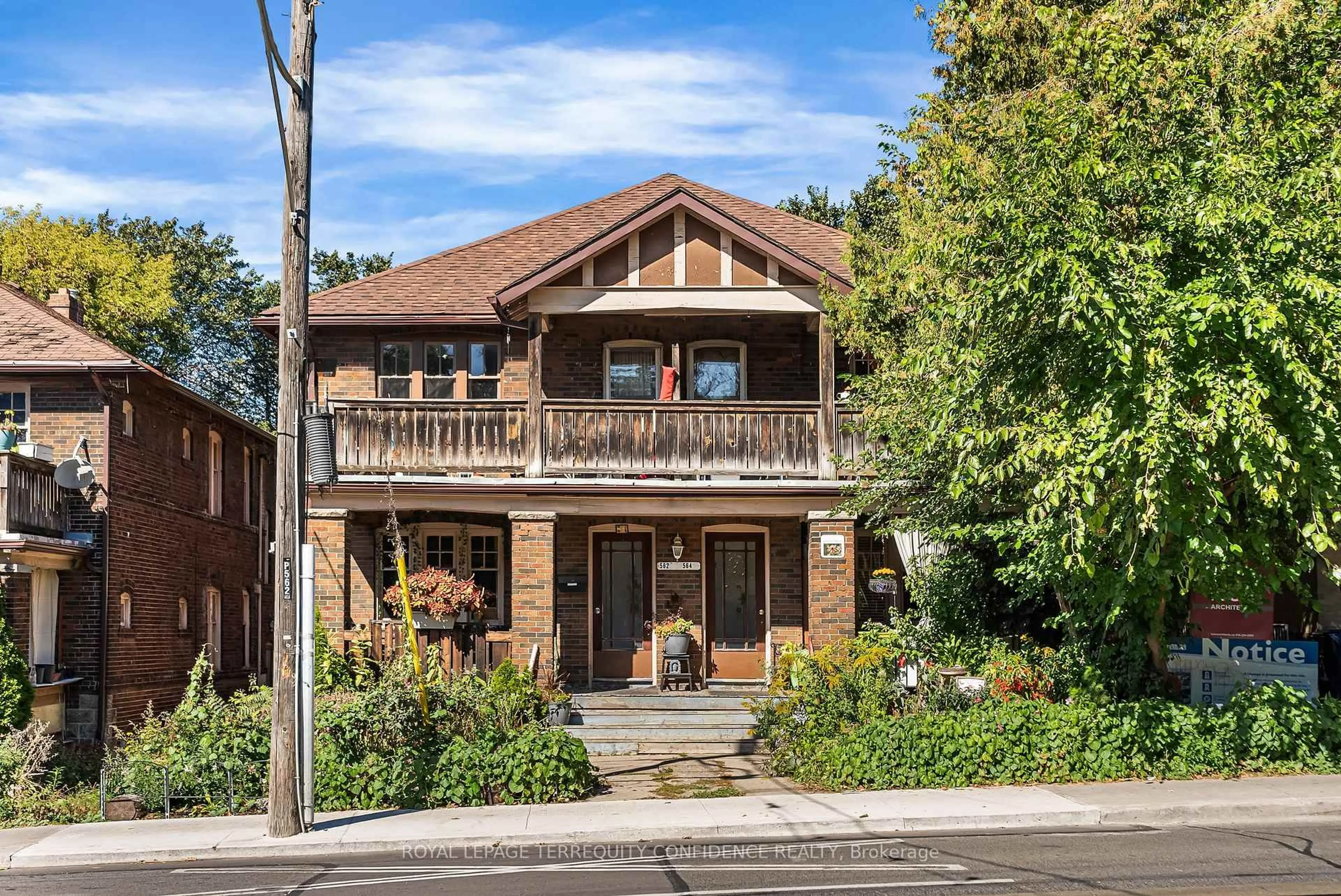 Home with brick exterior material, street for 558-562 Kingston Rd, Toronto Ontario M4E 1P9