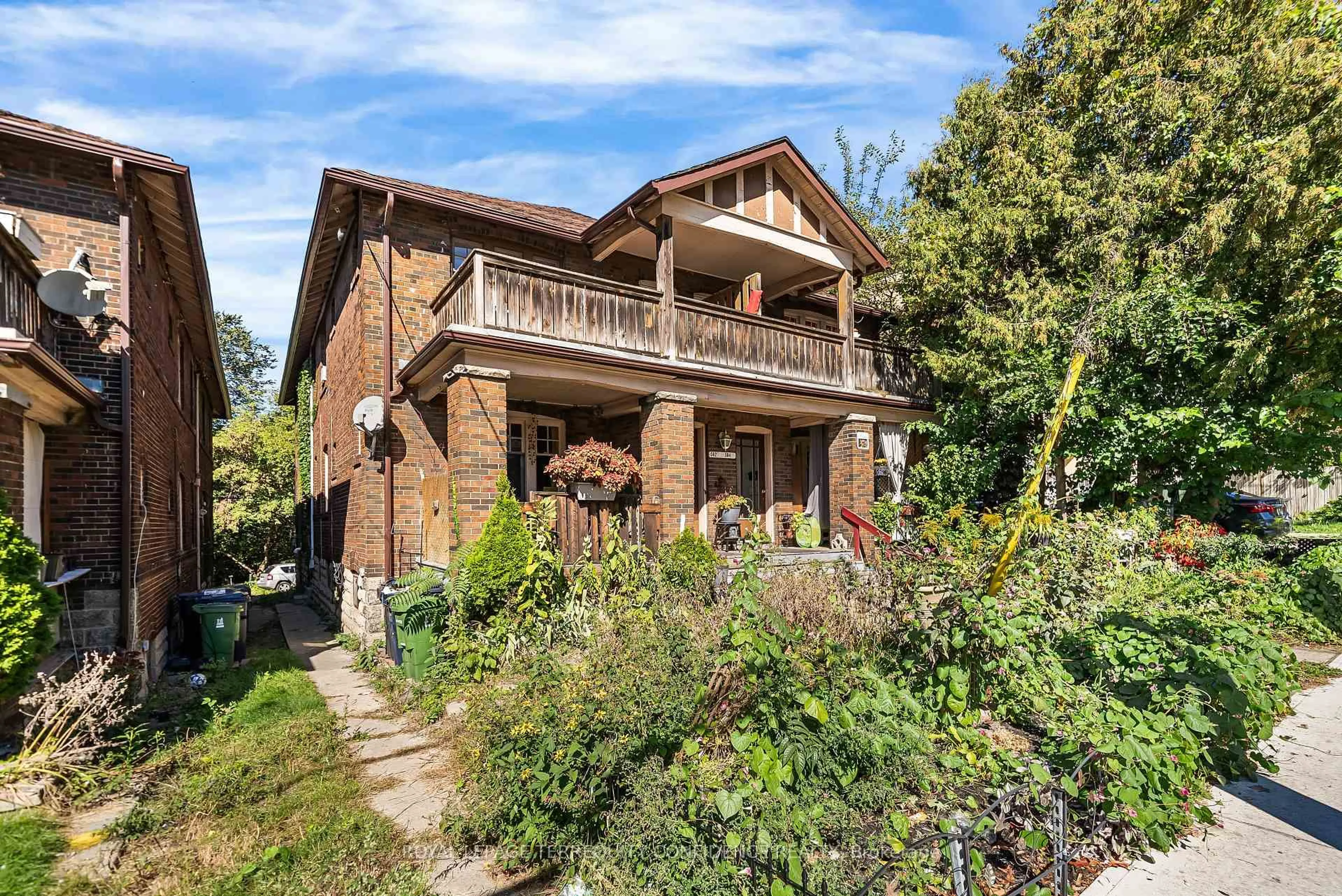 Home with brick exterior material, street for 558-562 Kingston Rd, Toronto Ontario M4E 1P9