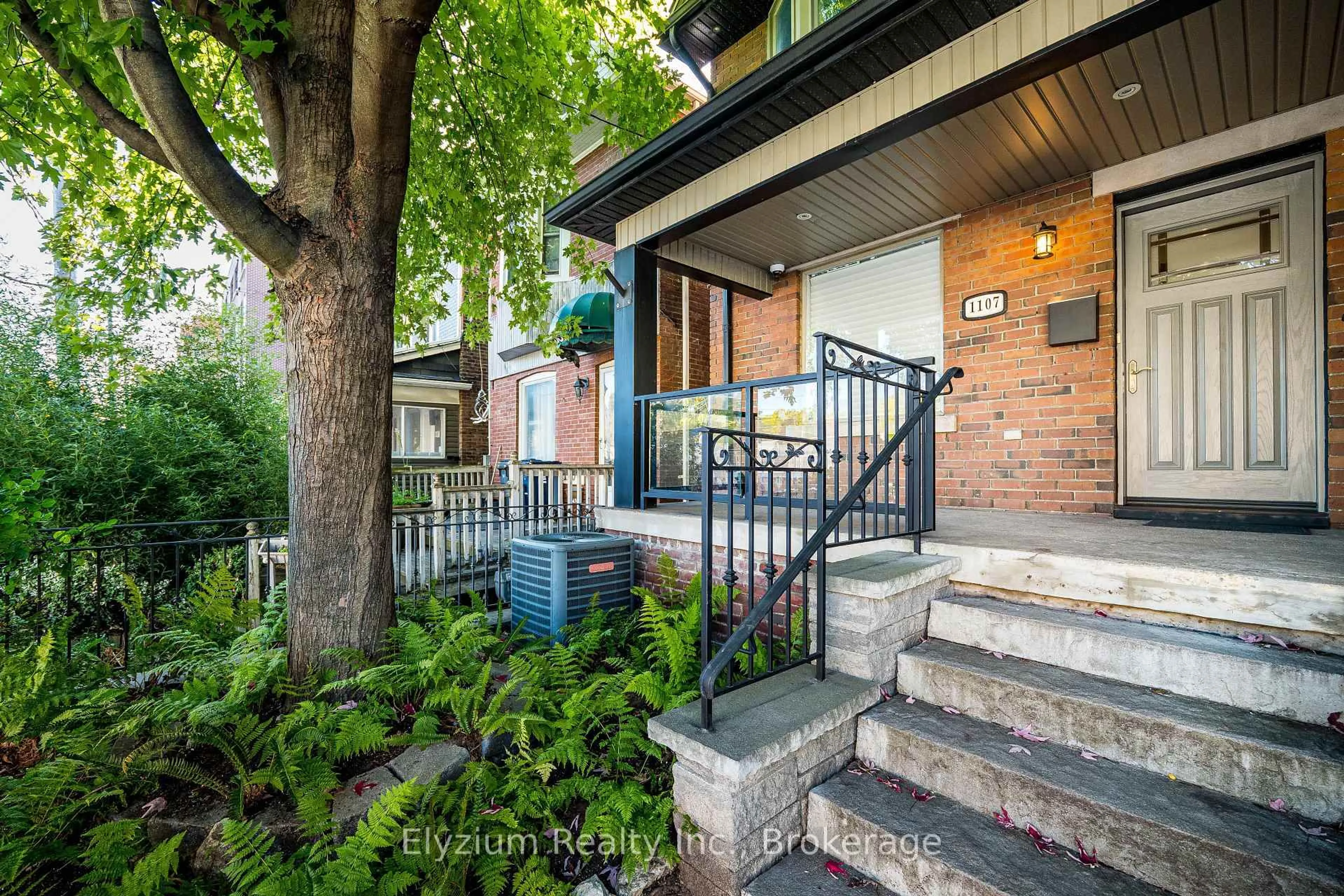 Home with brick exterior material, street for 1107 Gerrard St, Toronto Ontario M4M 1Z9