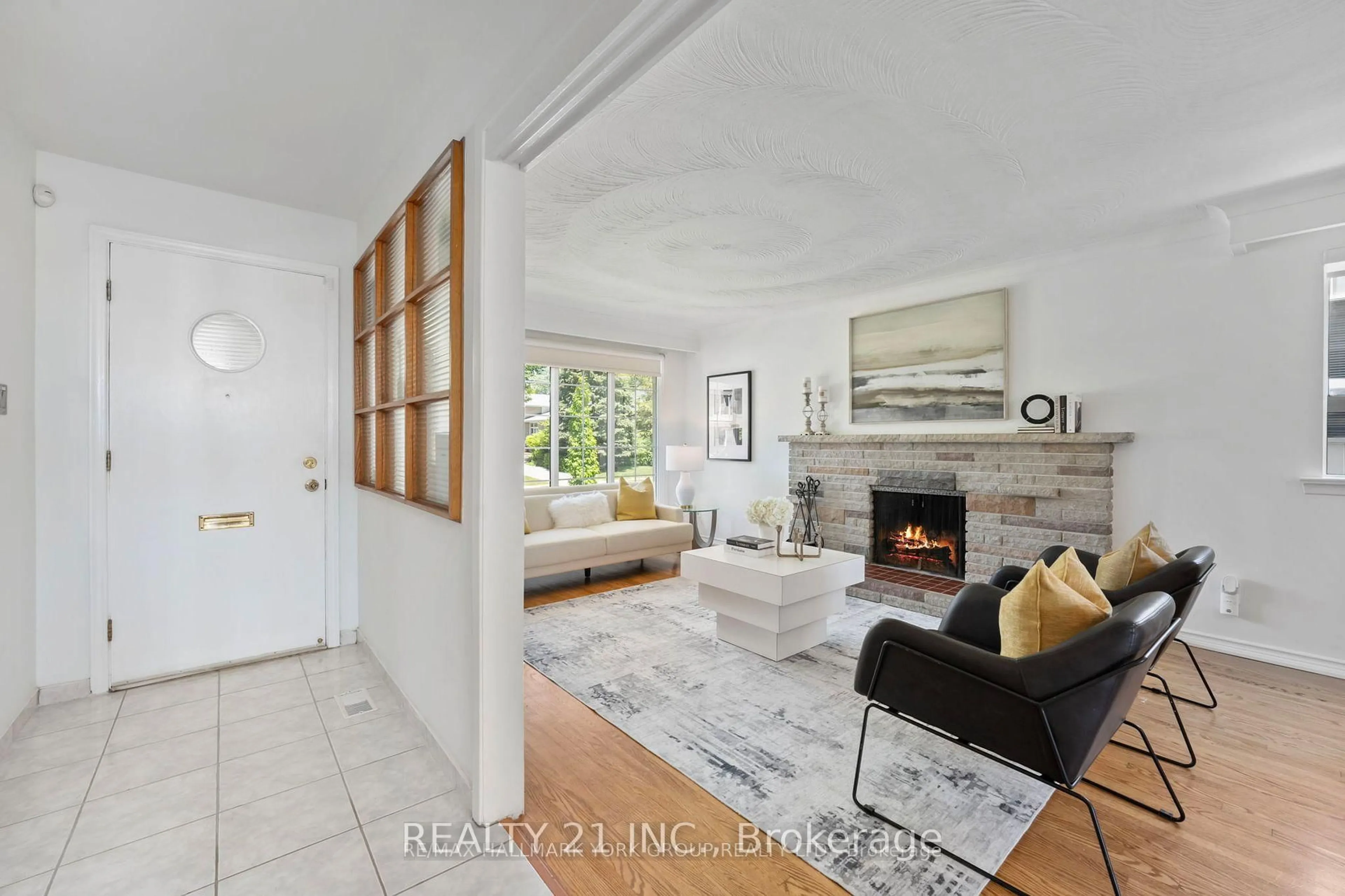 Living room with furniture, ceramic/tile floor for 51 Sloley Rd, Toronto Ontario M1M 1C7