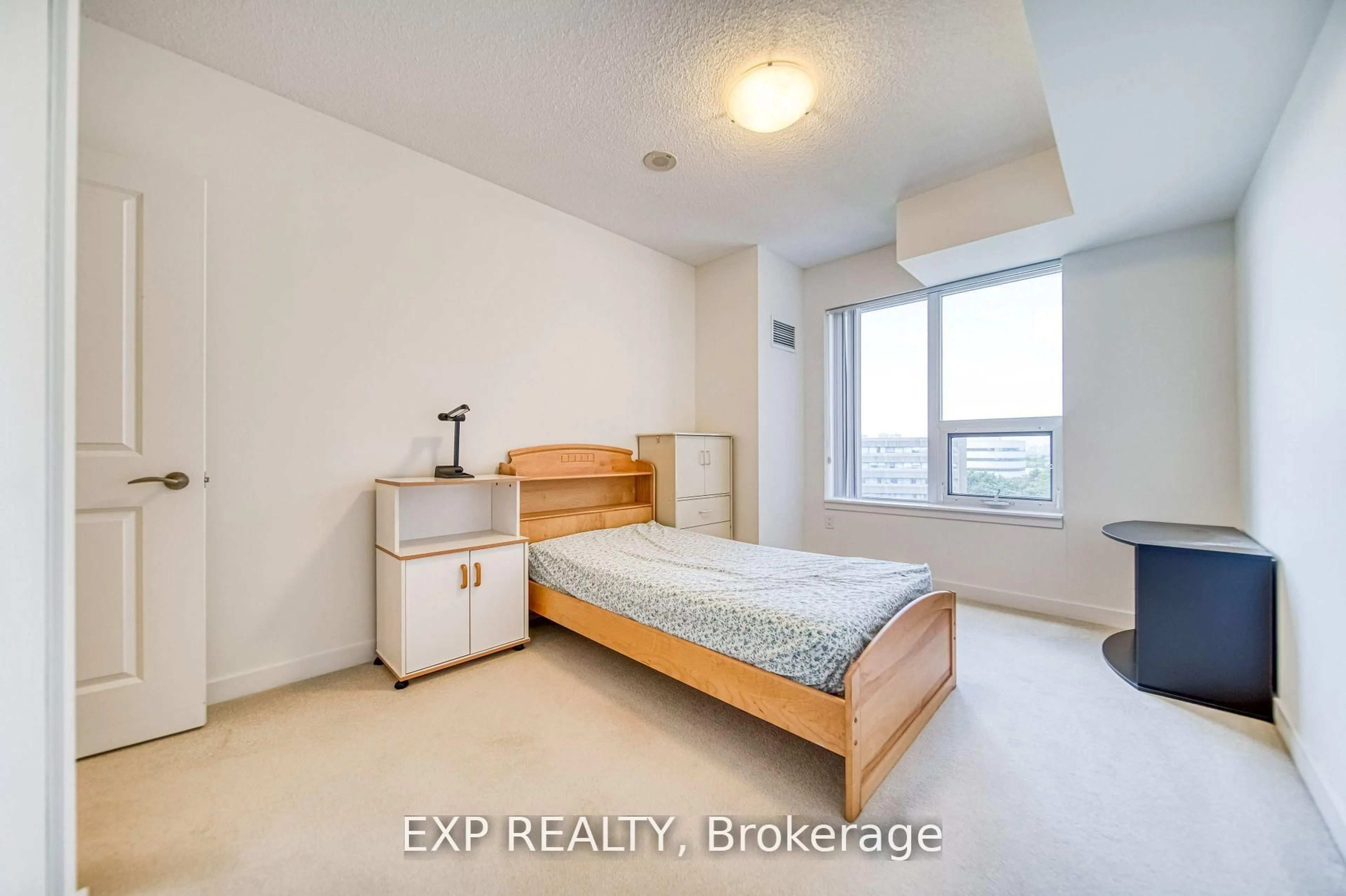 Bedroom with bed, wood/laminate floor for 1038 Mcnicoll Ave #707, Toronto Ontario M1W 0A4