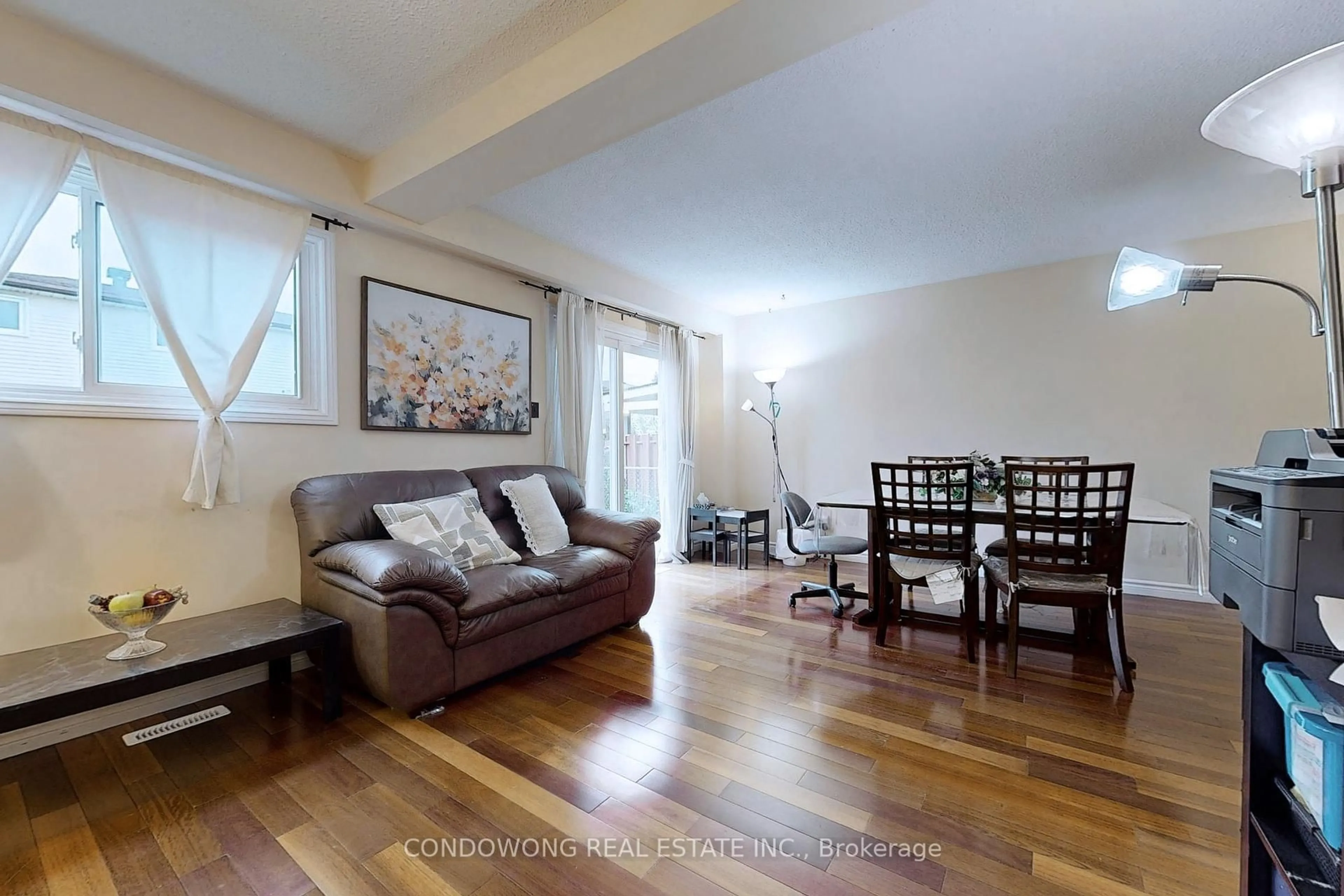 Living room with furniture, wood/laminate floor for 63 Revlis Cres, Toronto Ontario M1V 1E8