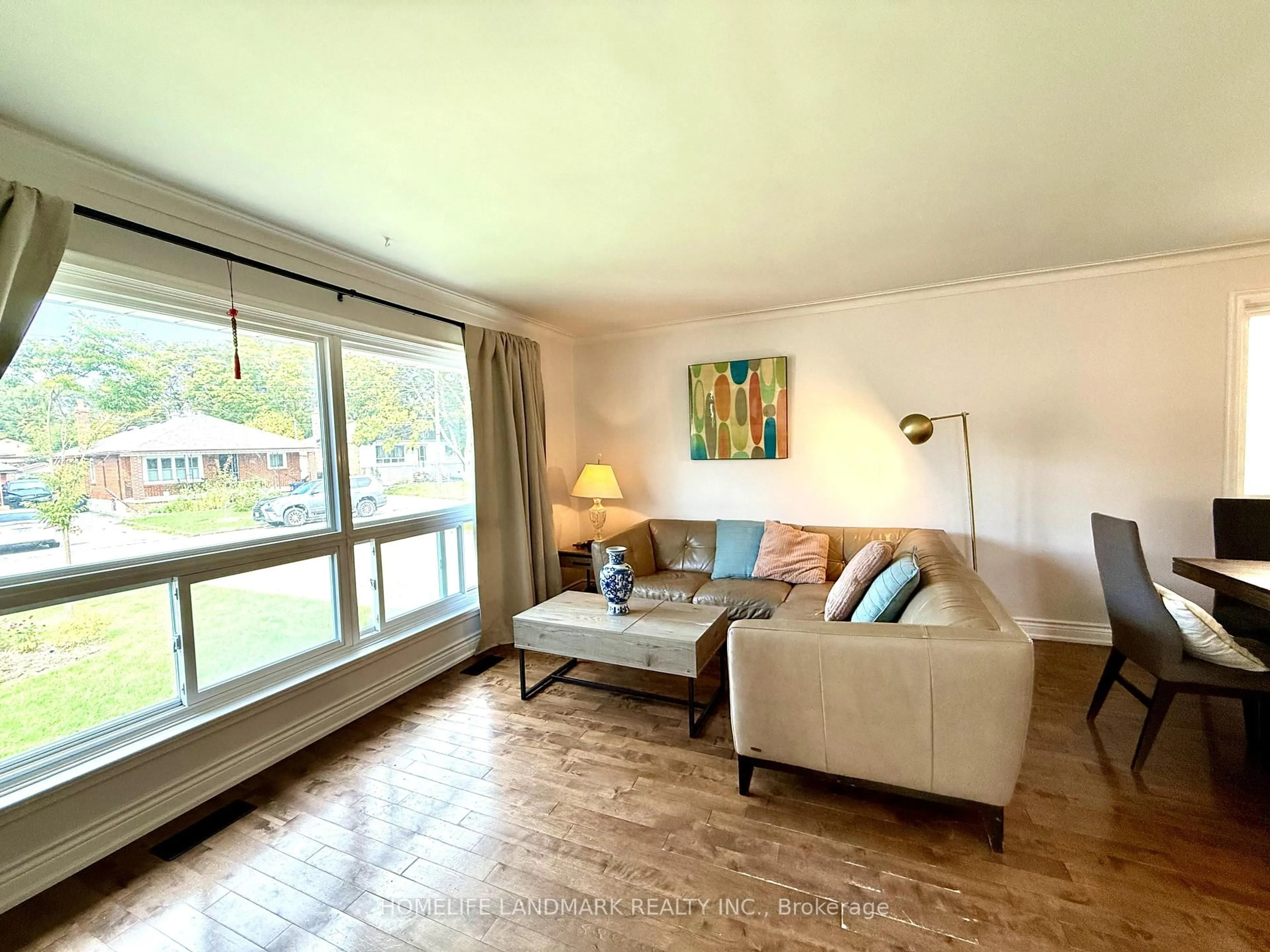 Living room with furniture, wood/laminate floor for 3 Colony Rd, Toronto Ontario M1R 3S1
