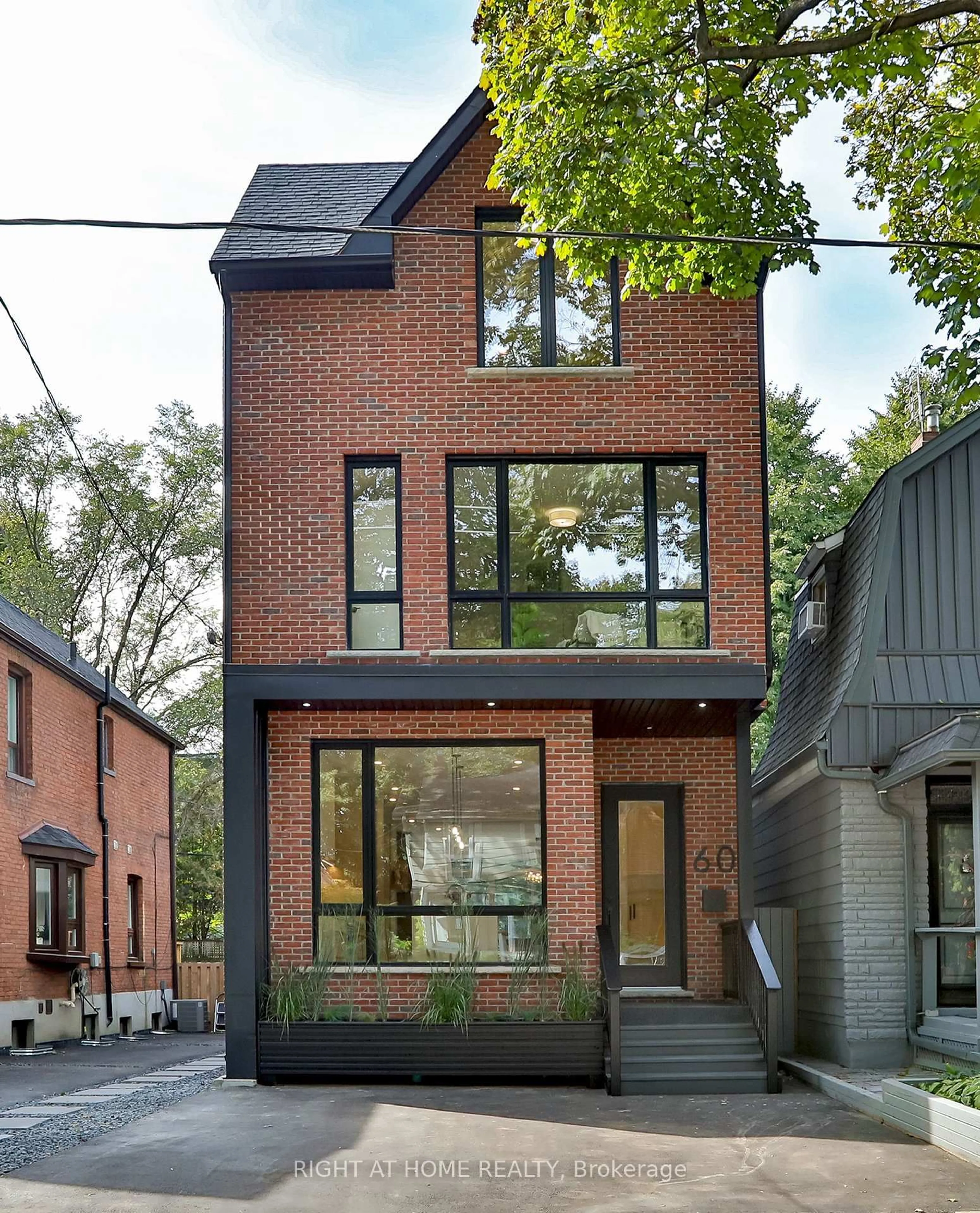 Home with brick exterior material, street for 60 Winnifred Ave, Toronto Ontario M4M 2X3