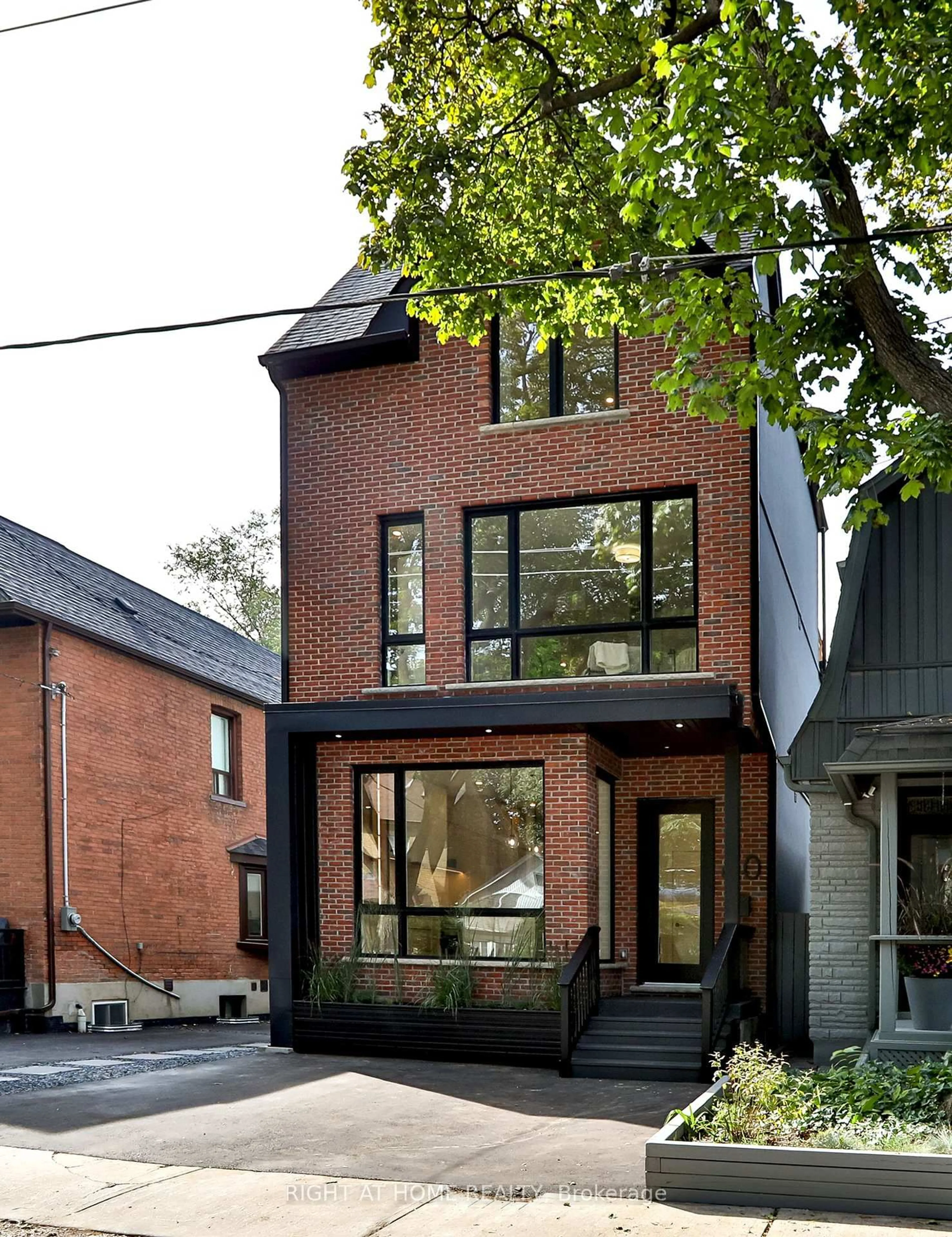 Home with brick exterior material, street for 60 Winnifred Ave, Toronto Ontario M4M 2X3