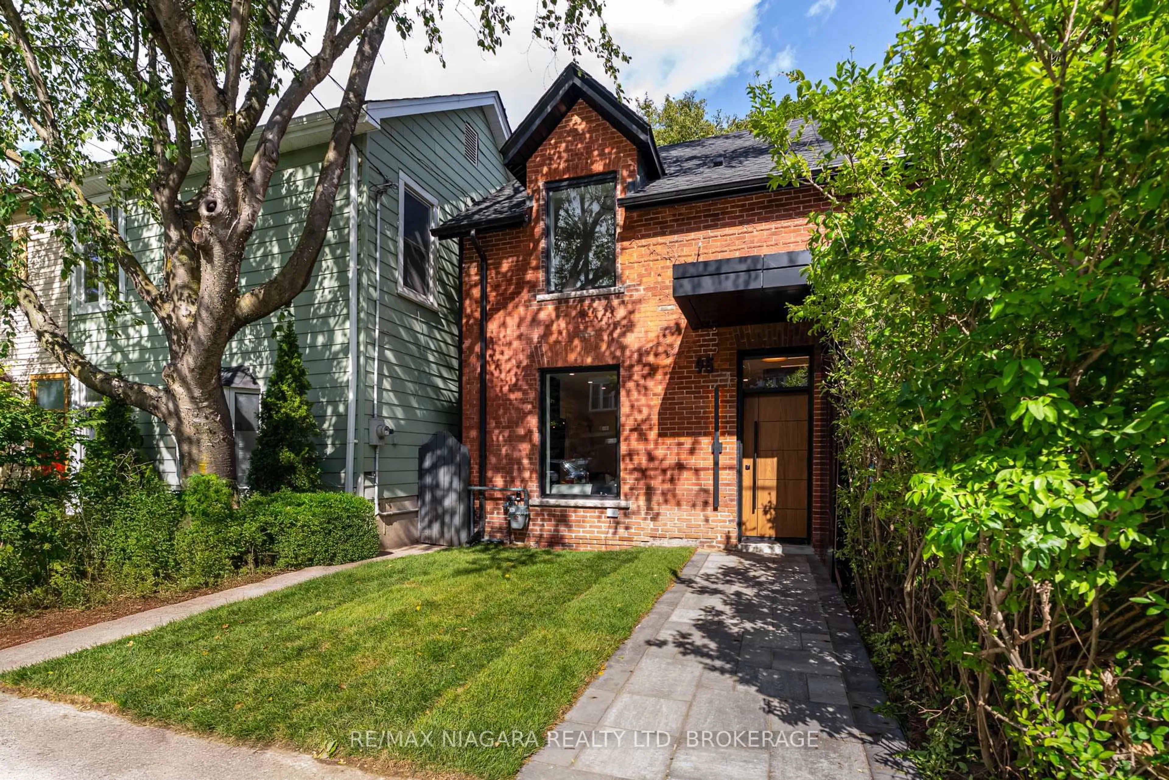 Home with brick exterior material, street for 95 Kimberley Ave, Toronto Ontario M4E 2Z4