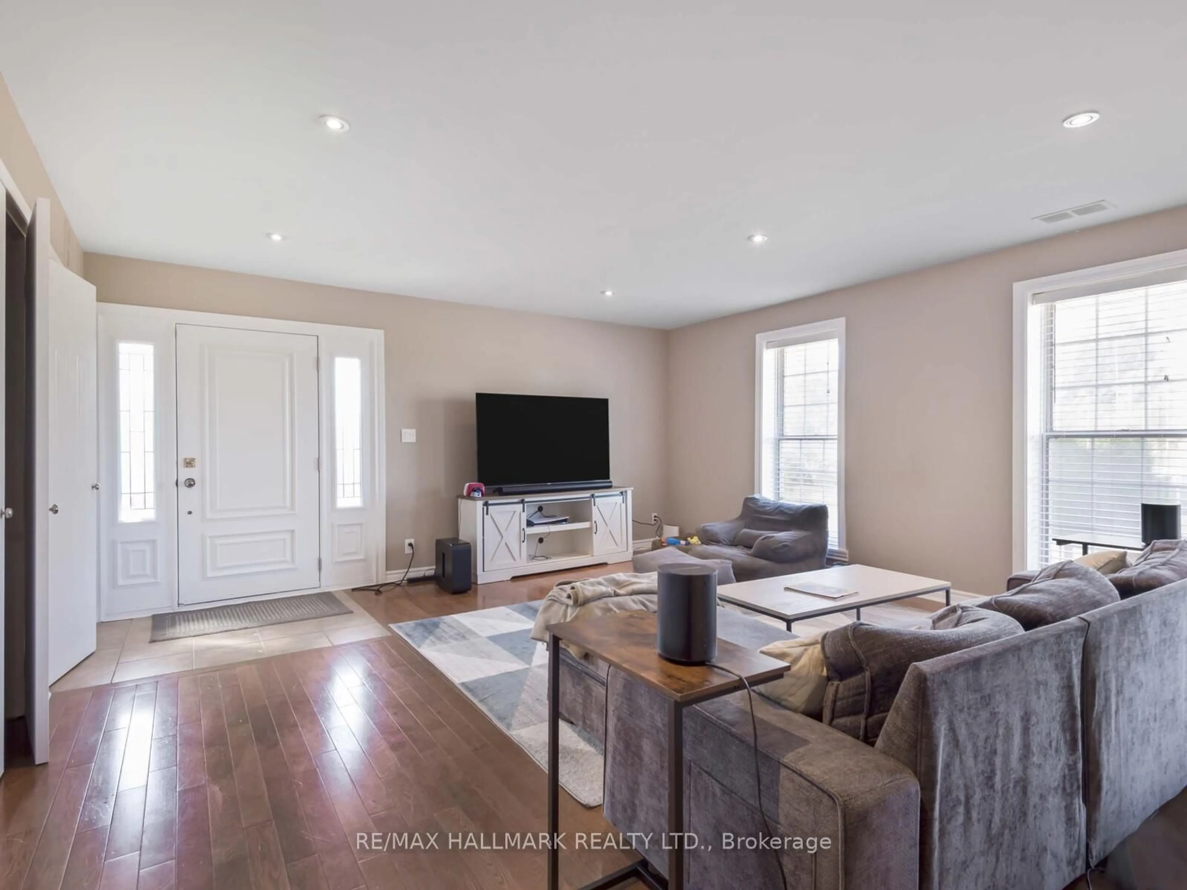 Living room with furniture, wood/laminate floor for 90 Leroy Ave, Toronto Ontario M4J 4G8