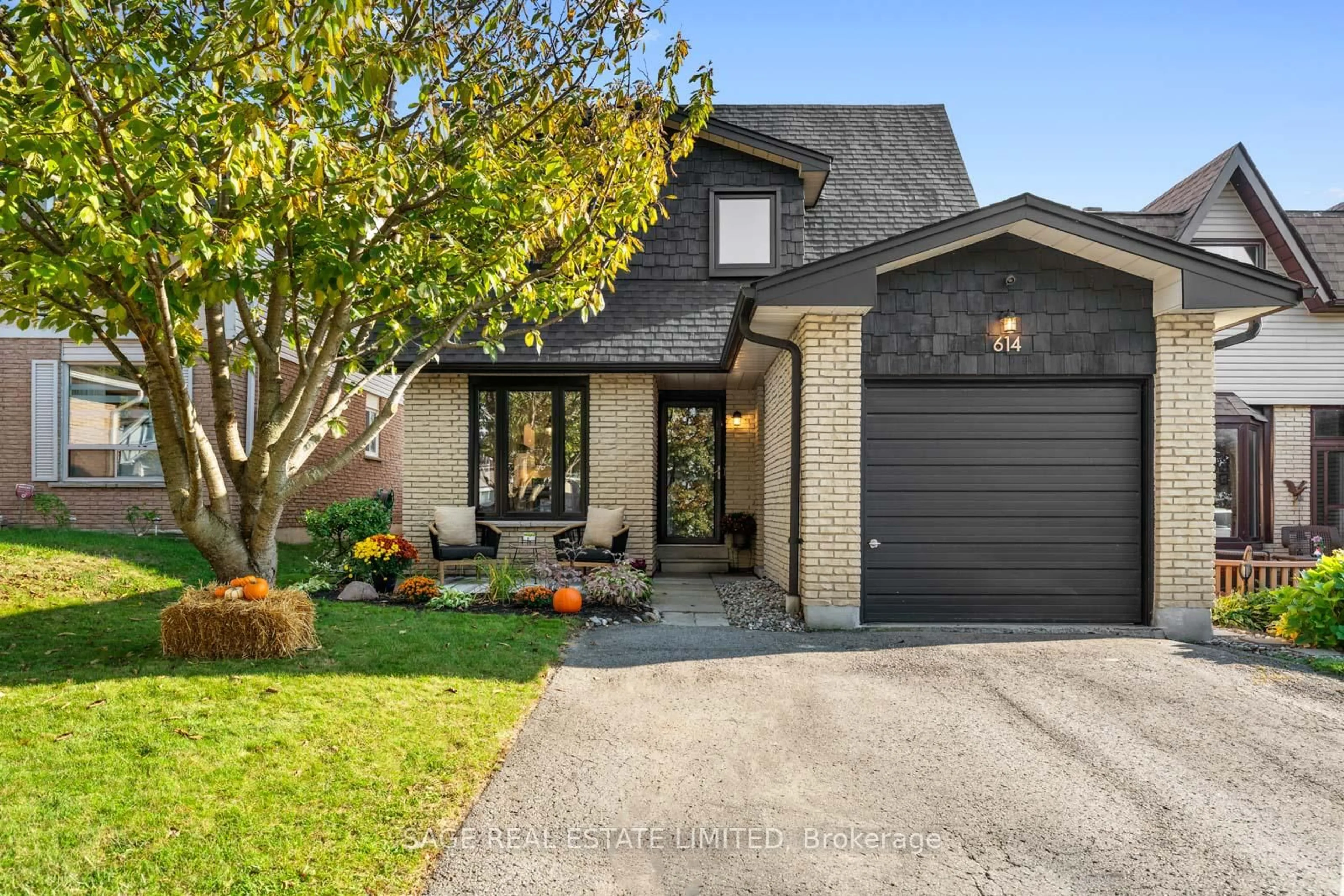 Home with brick exterior material, street for 614 Stonebridge Lane, Pickering Ontario L1W 3B3