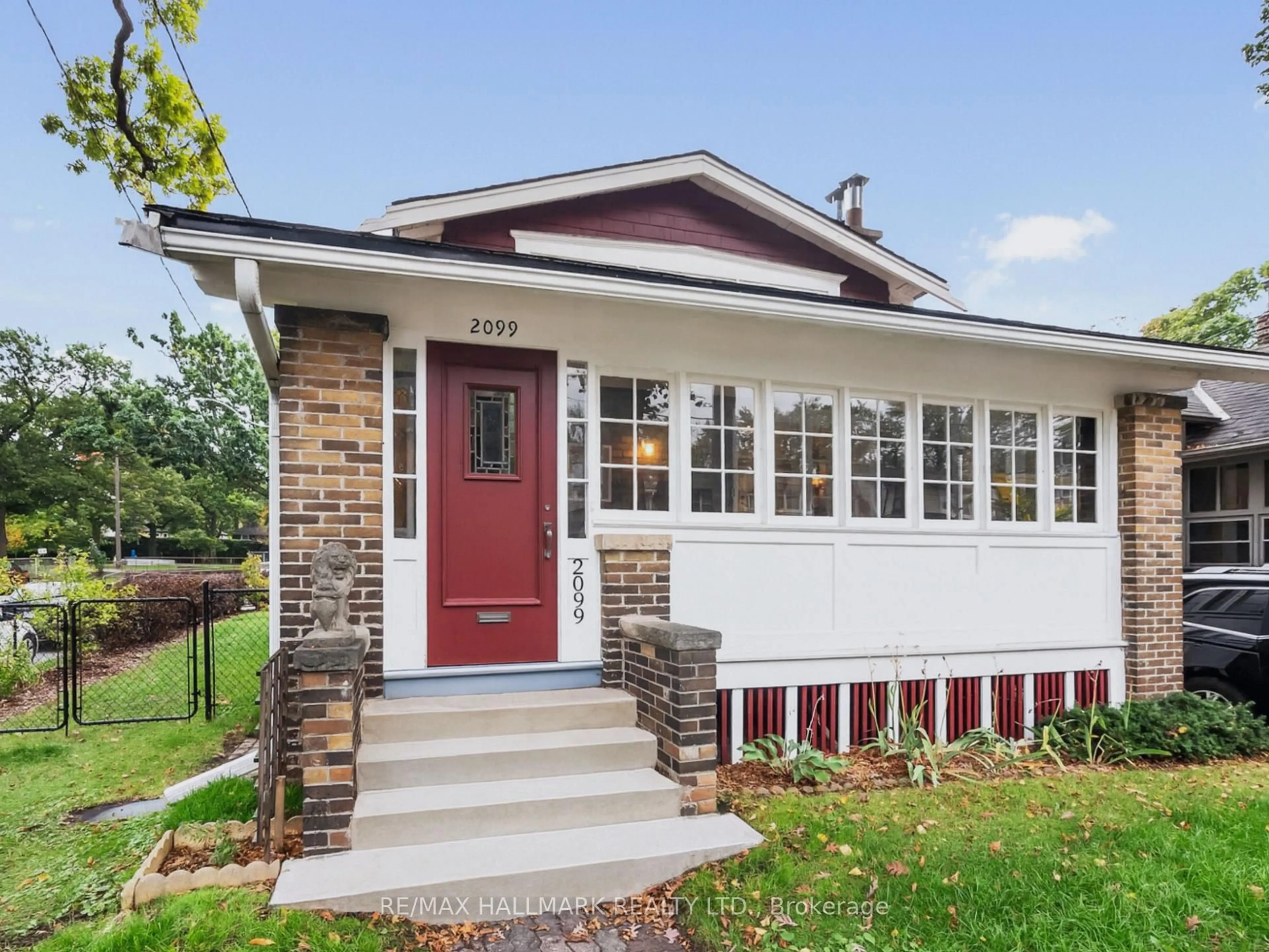 Home with brick exterior material, street for 2099 Gerrard St, Toronto Ontario M4E 2B9
