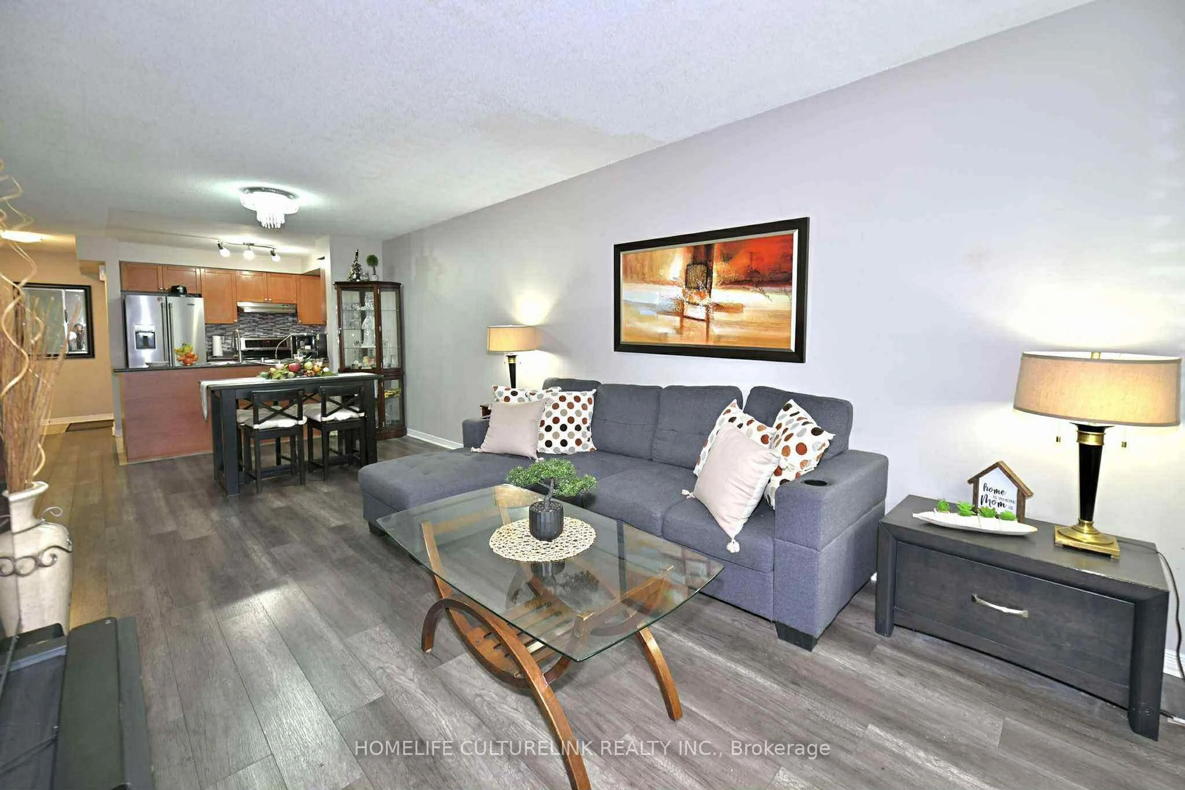 Living room with furniture, wood/laminate floor for 84 Petra Way #1, Whitby Ontario L1R 0A3