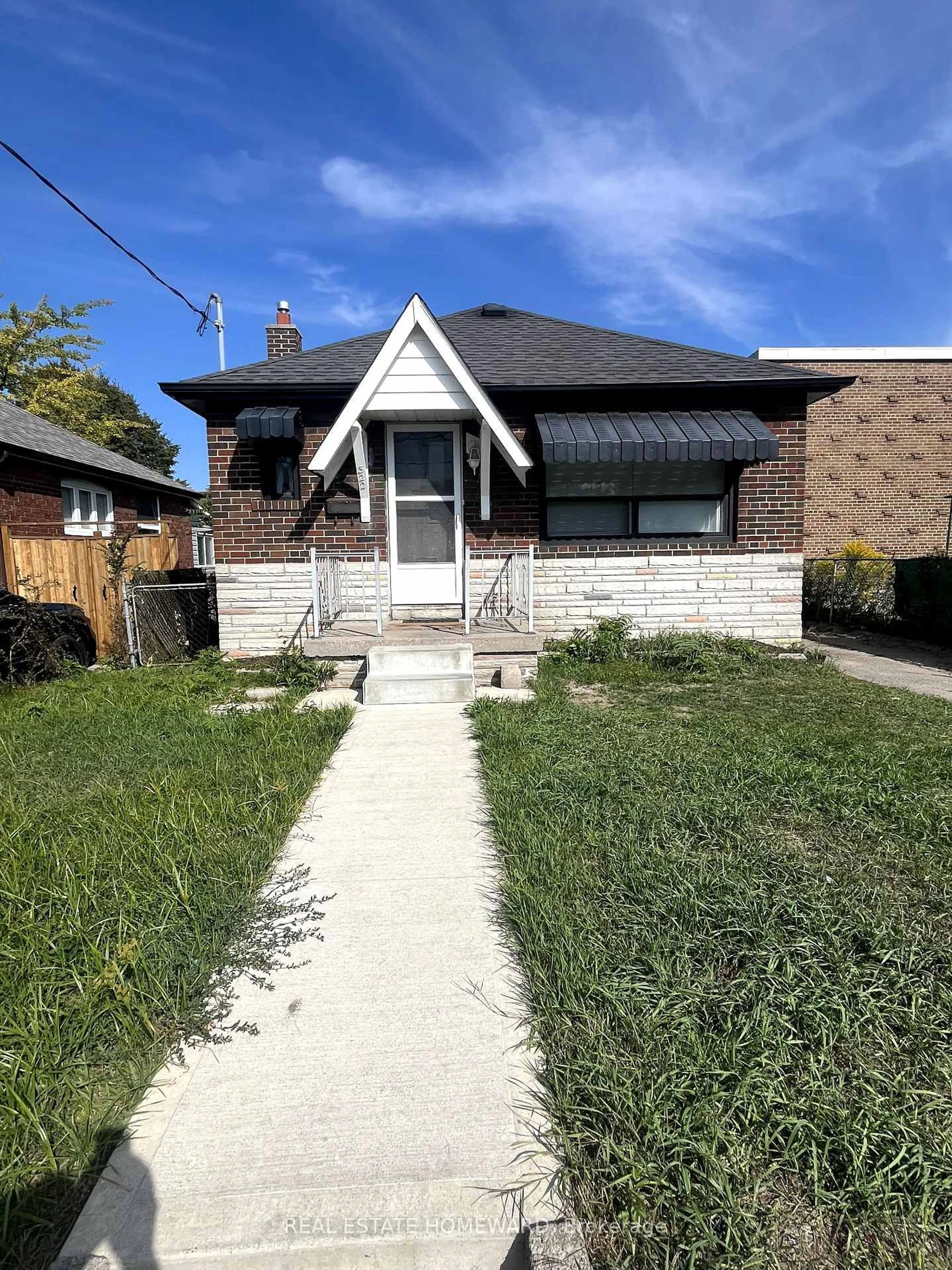 Home with brick exterior material, street for 322 Cosburn Ave, Toronto Ontario M4J 2M9