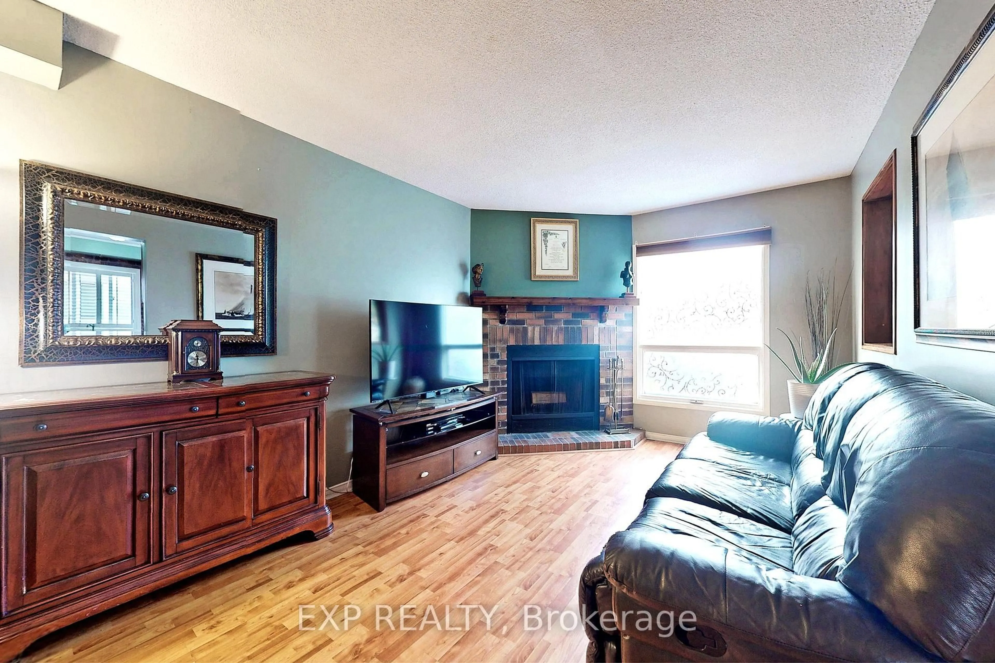 Living room with furniture, wood/laminate floor for 905 Rambleberry Ave, Pickering Ontario L1V 5Y1