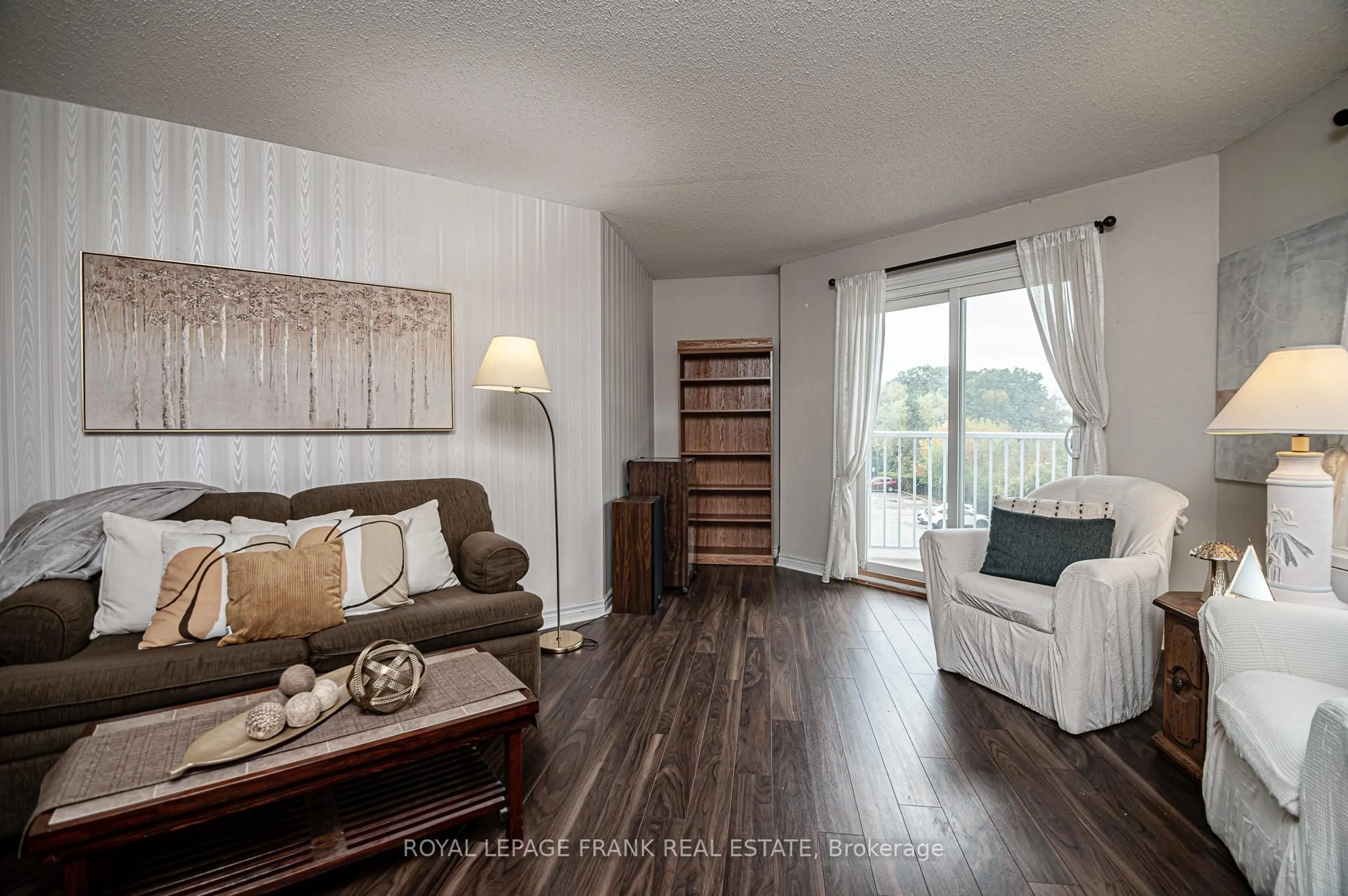 Living room with furniture, wood/laminate floor for 191 Lake Driveway Way #314, Ajax Ontario L1S 7H9