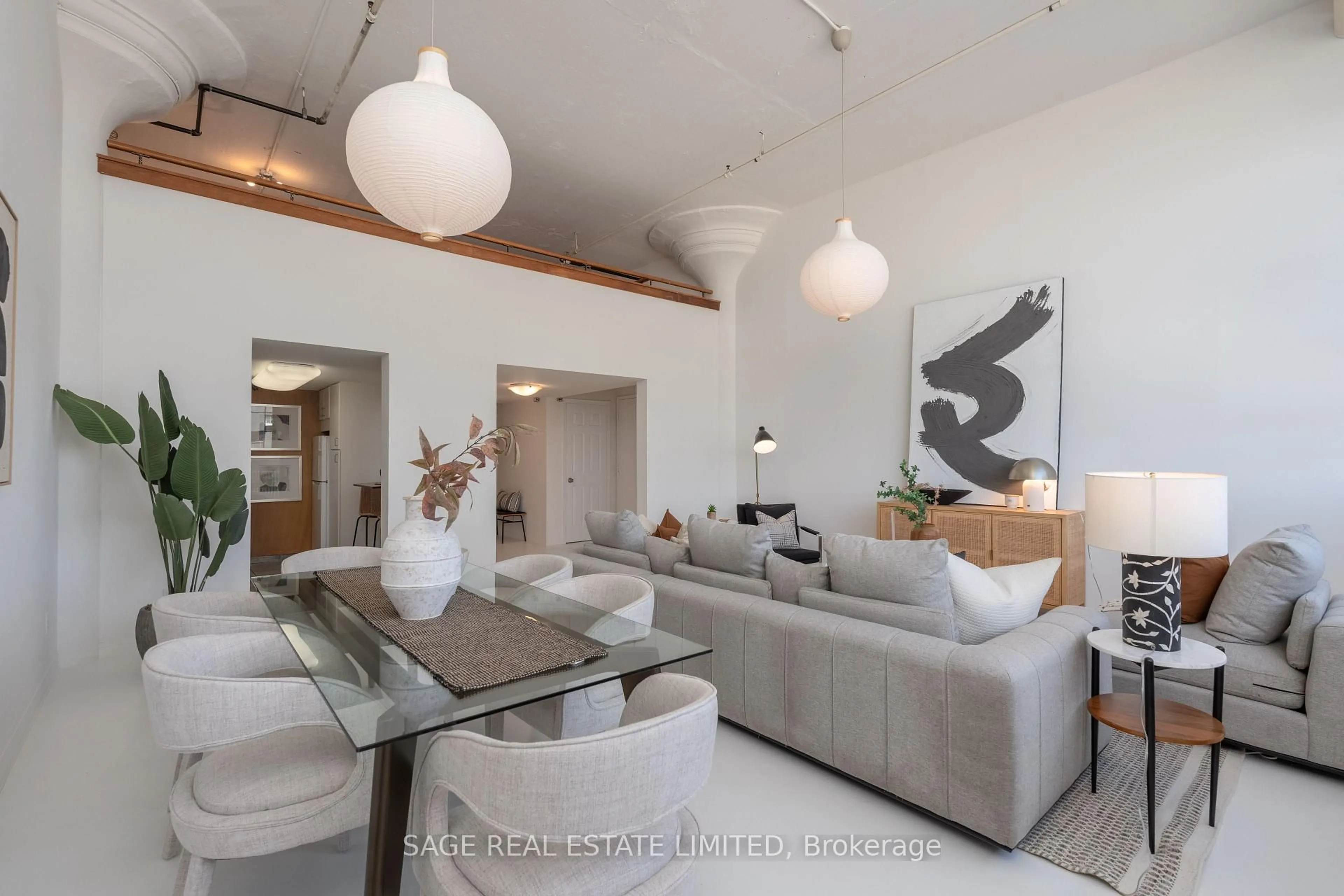 Living room with furniture, cement floor for 245 Carlaw Ave #403, Toronto Ontario M4M 2S1