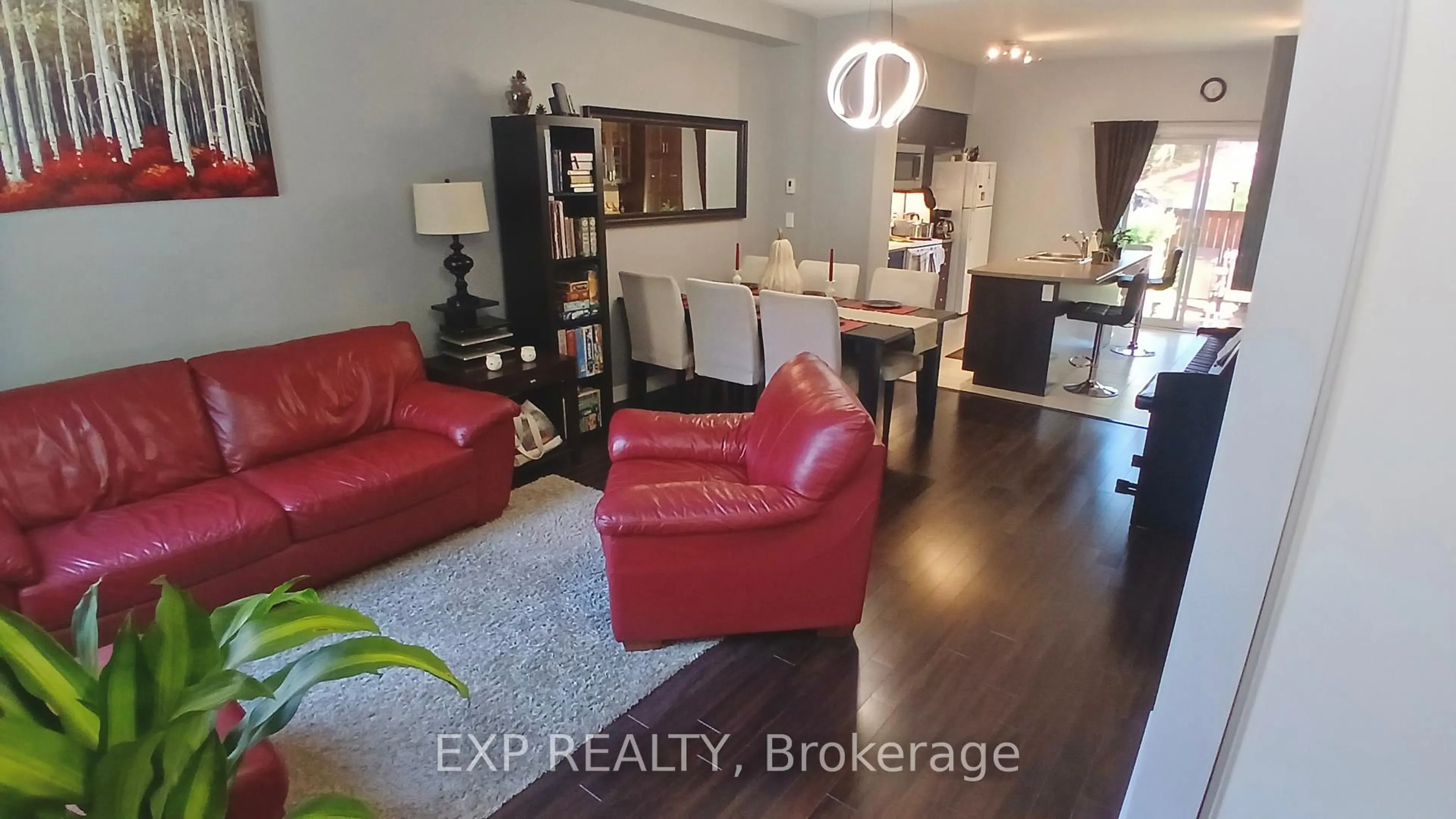 Living room with furniture, wood/laminate floor for 17 Montoro Lane, Toronto Ontario M1E 0B1