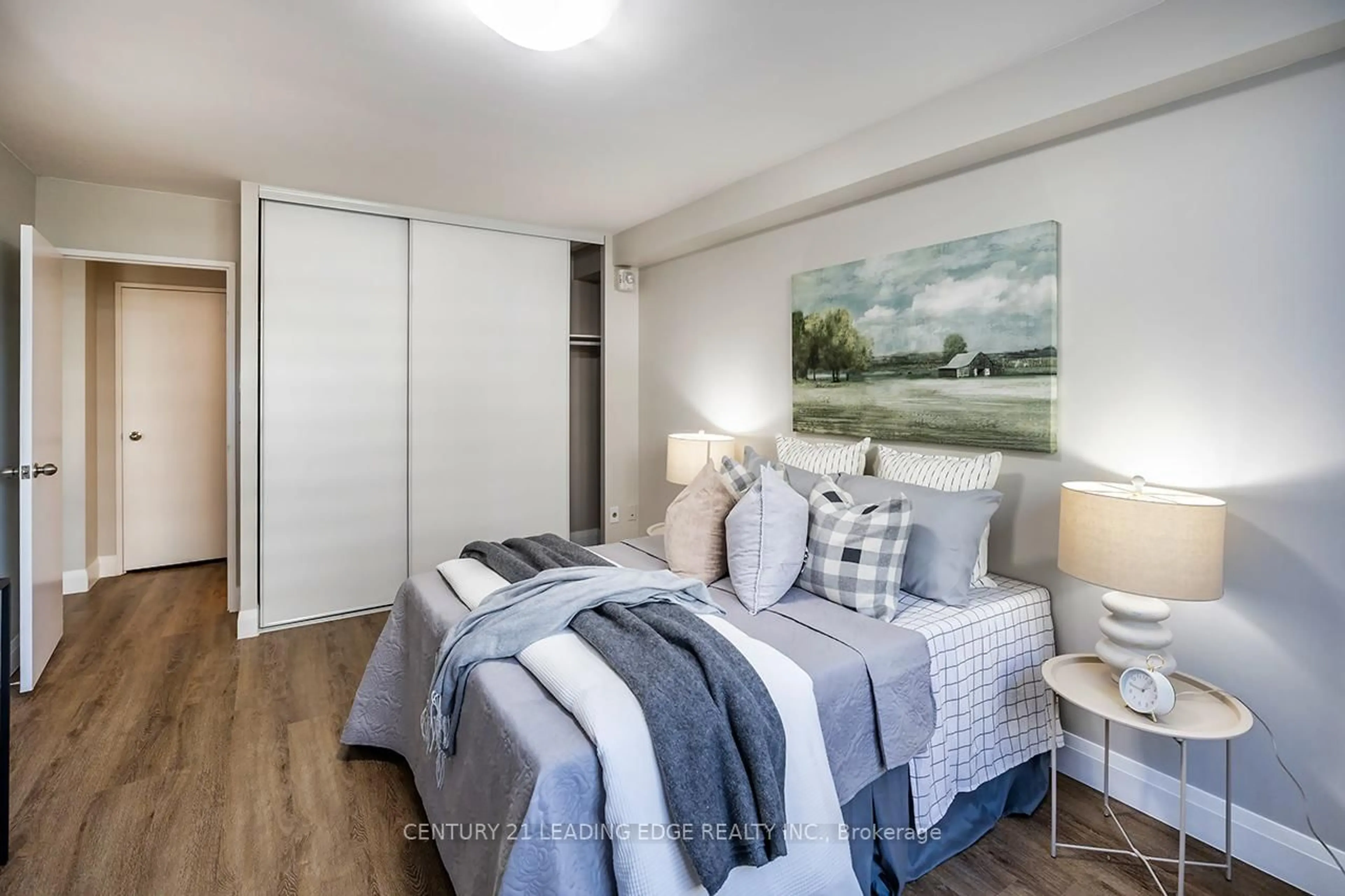 Bedroom with bed, wood/laminate floor for 101 Prudential Dr #304, Toronto Ontario M1P 4S5