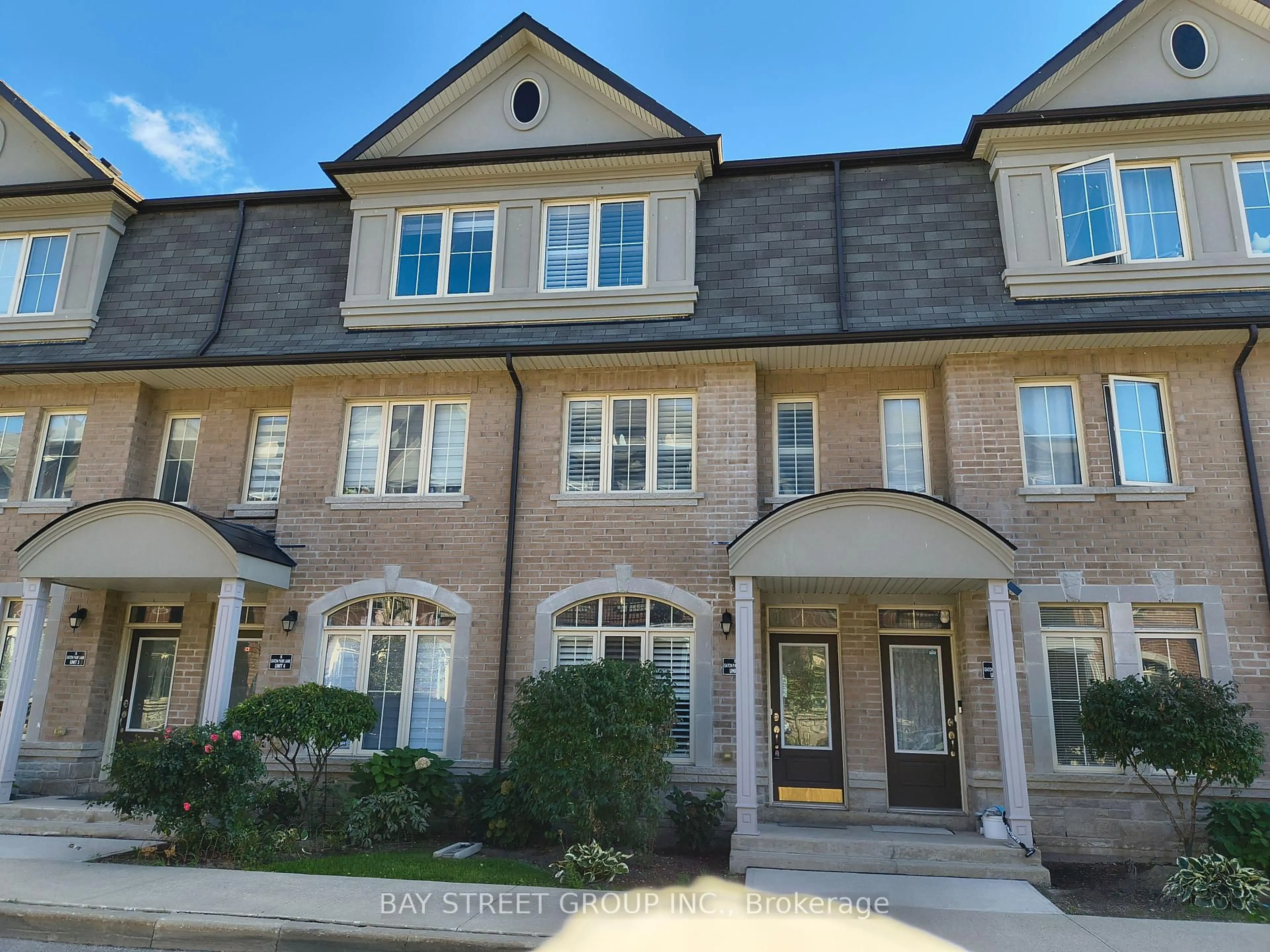 Home with brick exterior material, street for 5 Eaton Park Lane #5, Toronto Ontario M1W 0A5