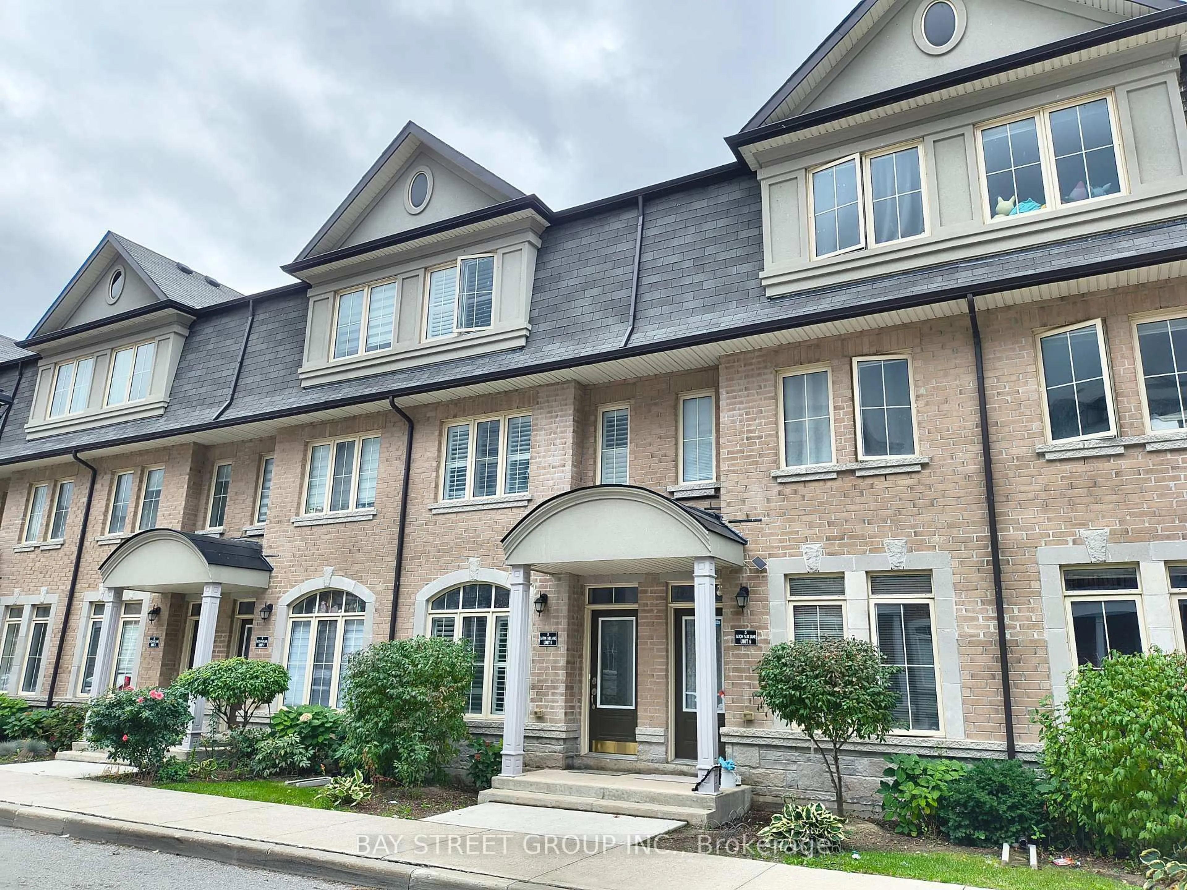 Home with brick exterior material, street for 5 Eaton Park Lane #5, Toronto Ontario M1W 0A5