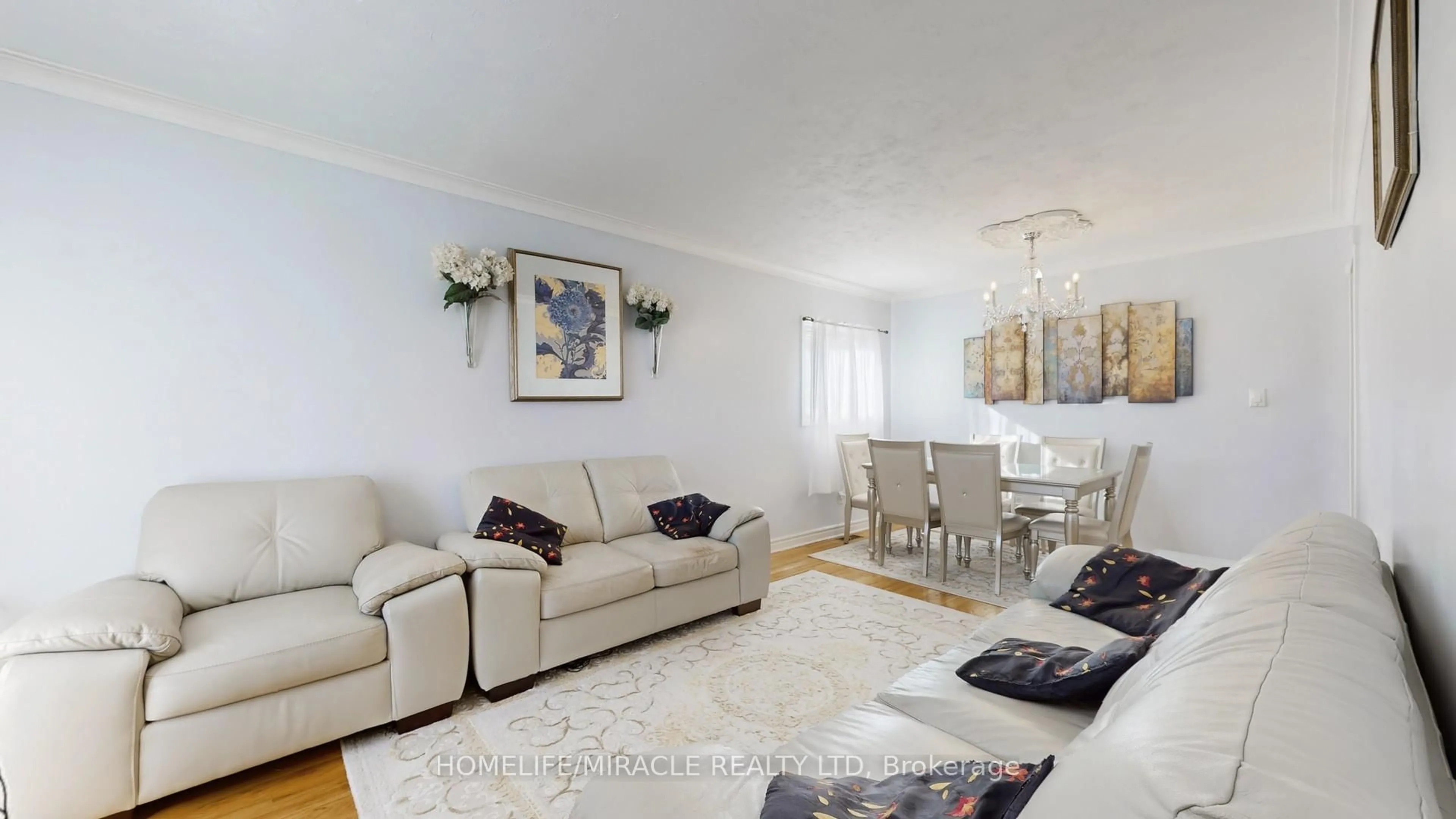 Living room with furniture, wood/laminate floor for 48 Frey Cres, Toronto Ontario M1R 2C7