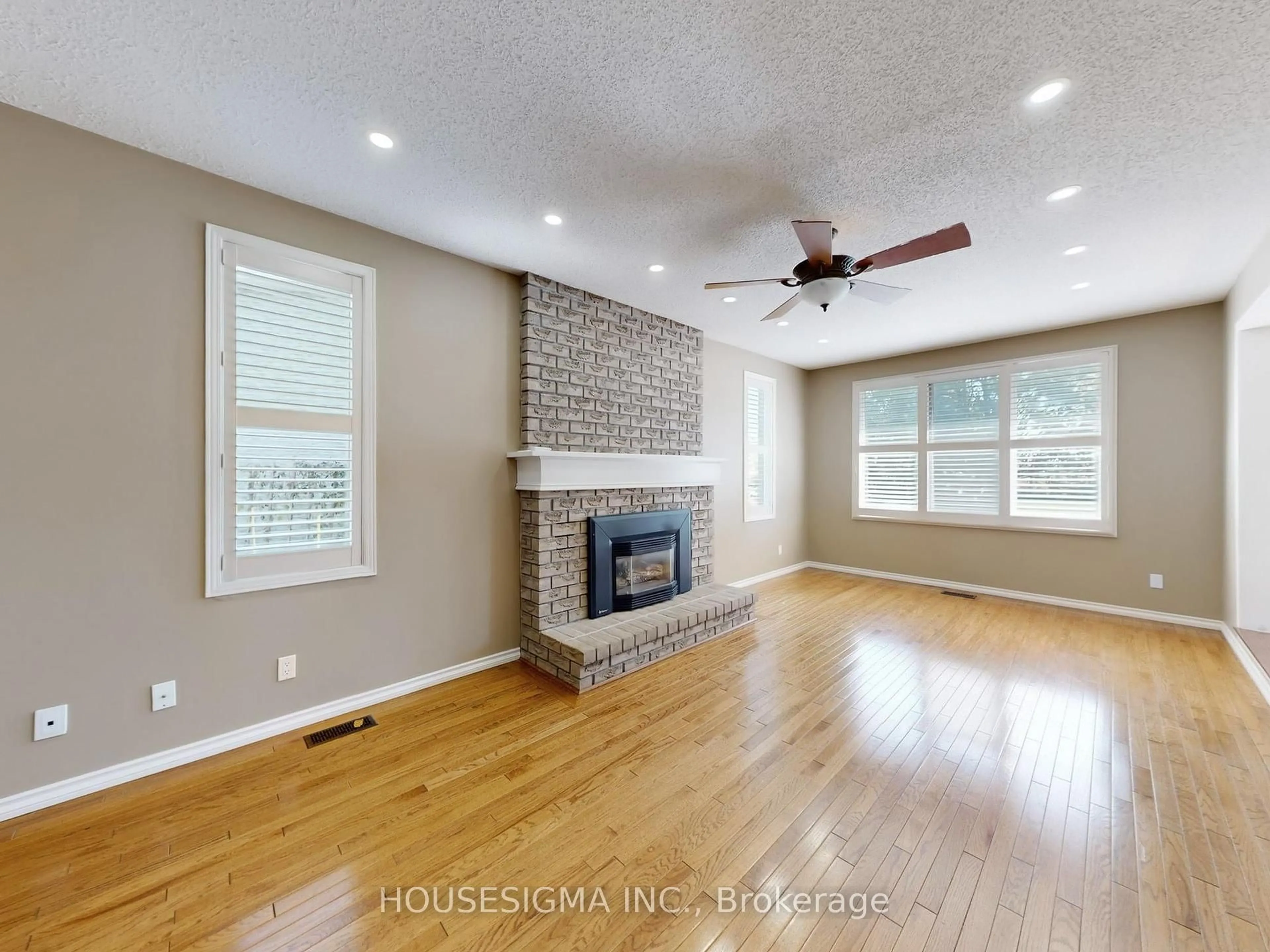 Living room with furniture, wood/laminate floor for 952 Peggoty Circ, Oshawa Ontario L1K 2G5