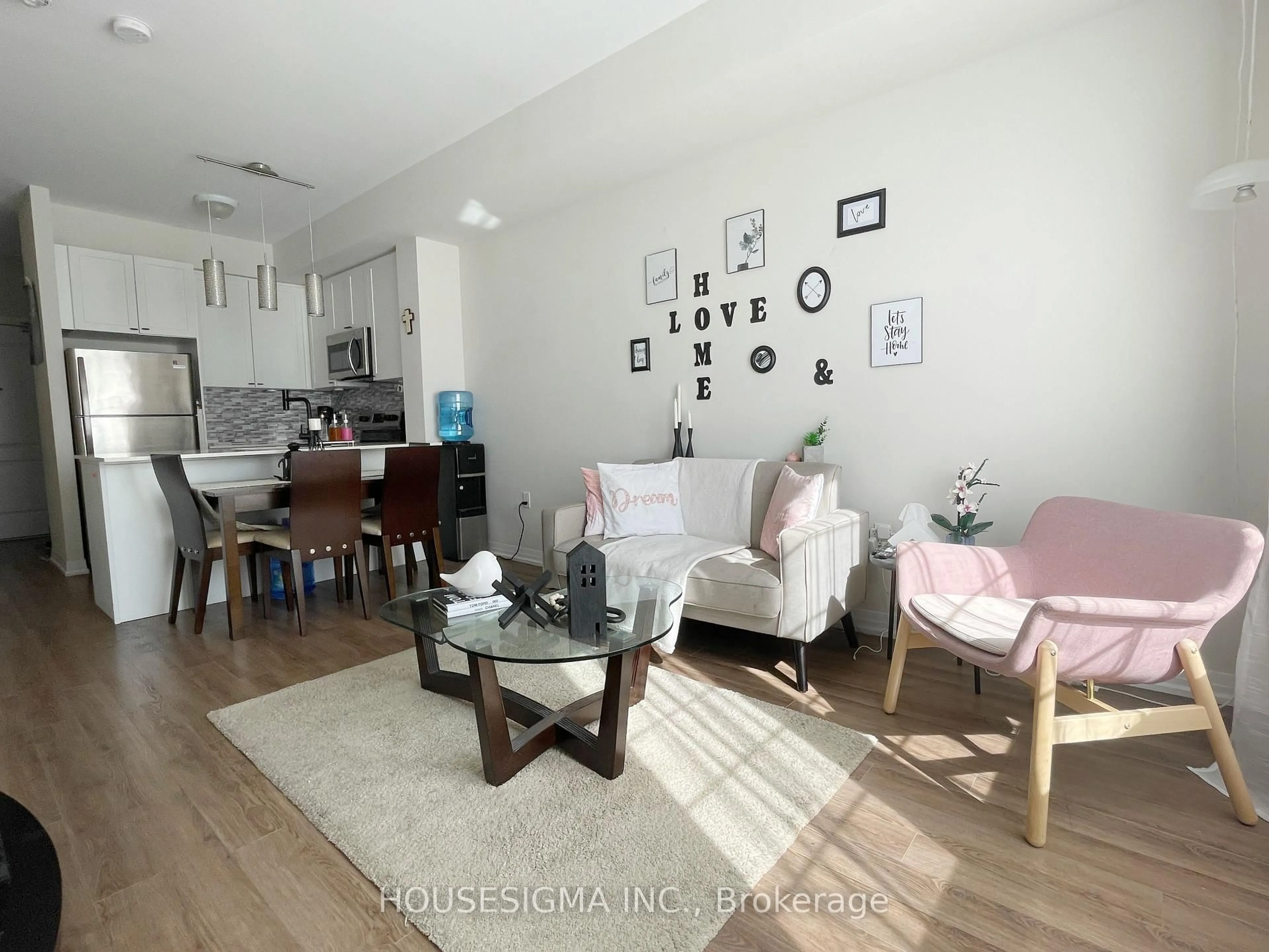 Living room with furniture, wood/laminate floor for 65 Shipway Ave #110, Clarington Ontario L1B 0W2