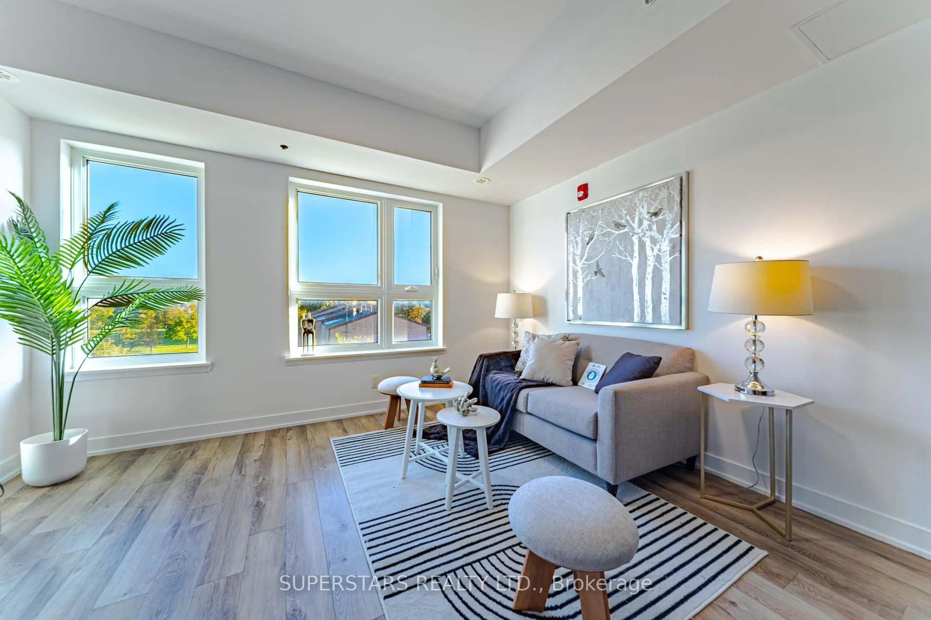 Living room with furniture, unknown for 2100 Bridletowne Circ #305, Toronto Ontario M1W 0A6