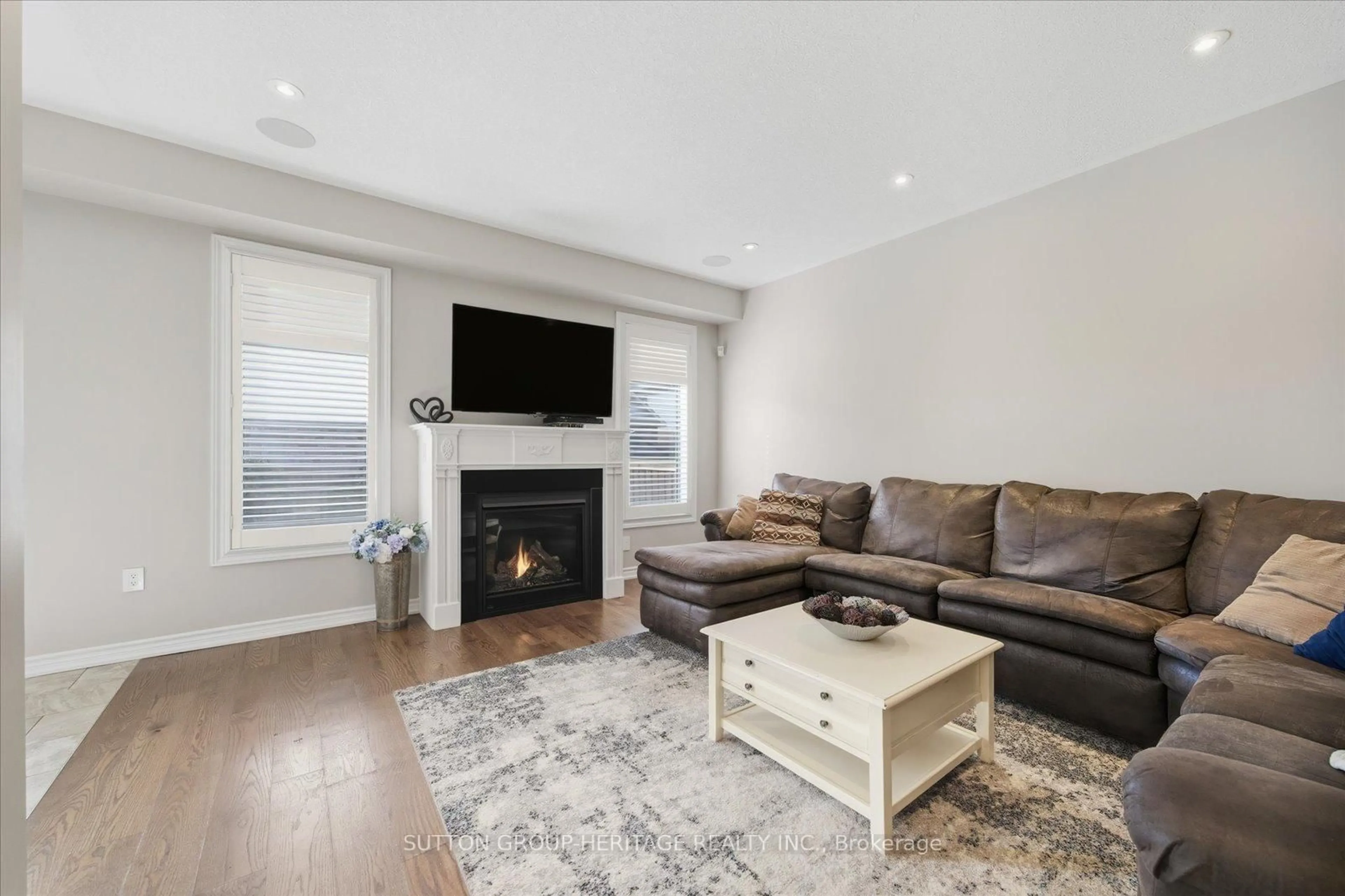 Living room with furniture, wood/laminate floor for 88 Roy Nichols Dr, Clarington Ontario L1E 0H6