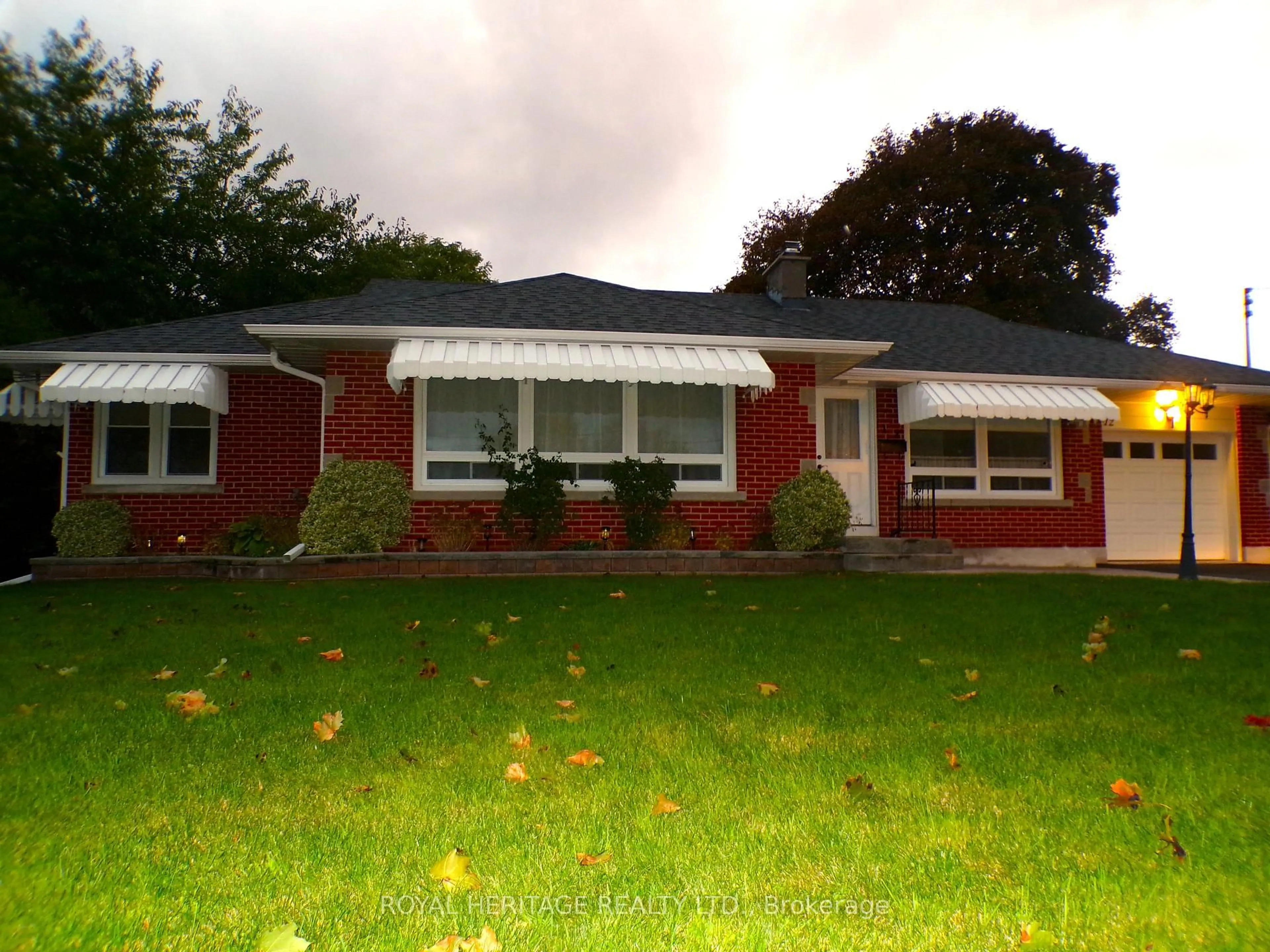 Home with vinyl exterior material, street for 12 Darlington Blvd, Clarington Ontario L1E 2J7