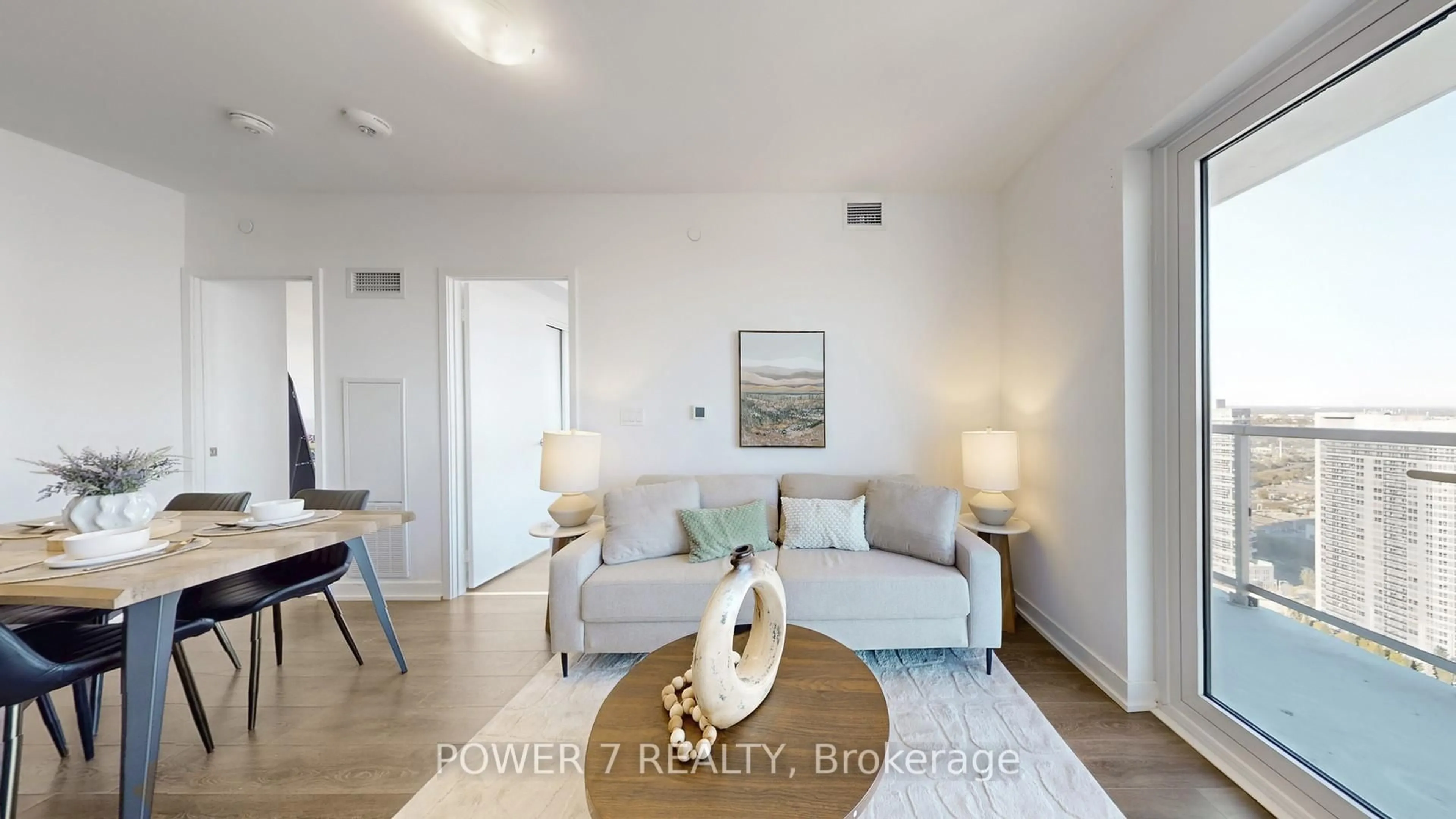 Living room with furniture, wood/laminate floor for 2033 Kennedy Rd Rd #3605, Toronto Ontario M4J 1Y6