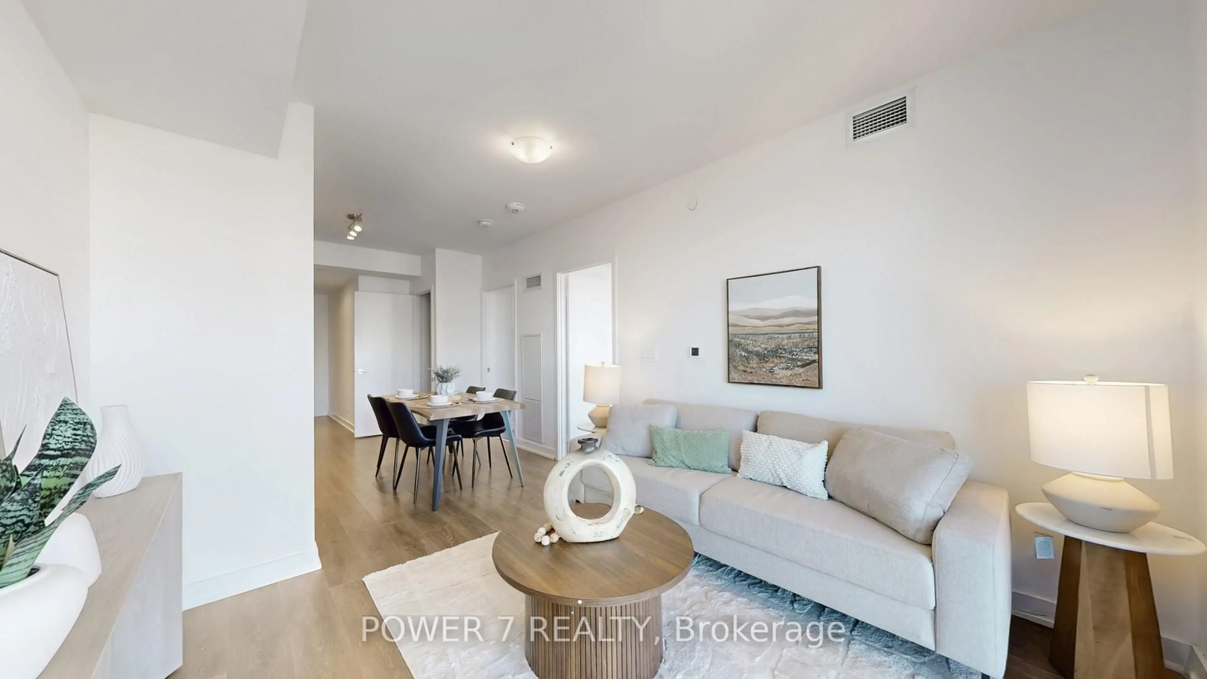 Living room with furniture, wood/laminate floor for 2033 Kennedy Rd Rd #3605, Toronto Ontario M4J 1Y6