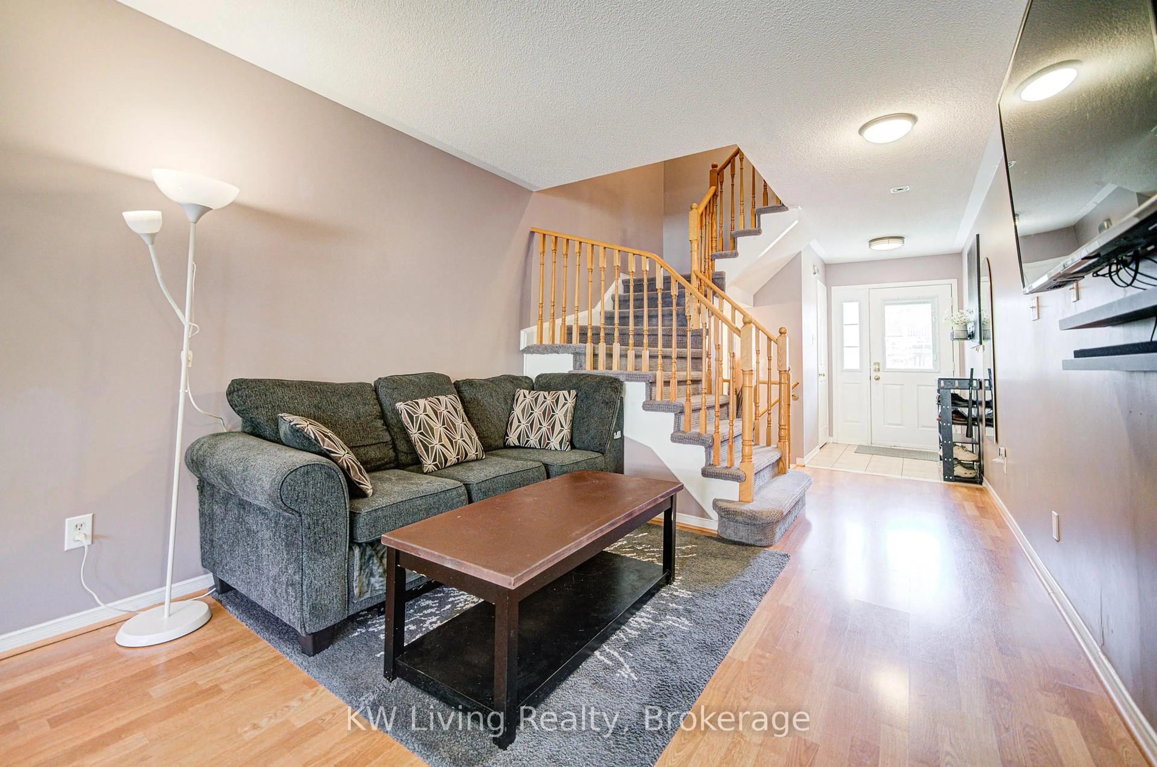 Living room with furniture, wood/laminate floor for 52 Moorefield Dr, Toronto Ontario M1C 5B6