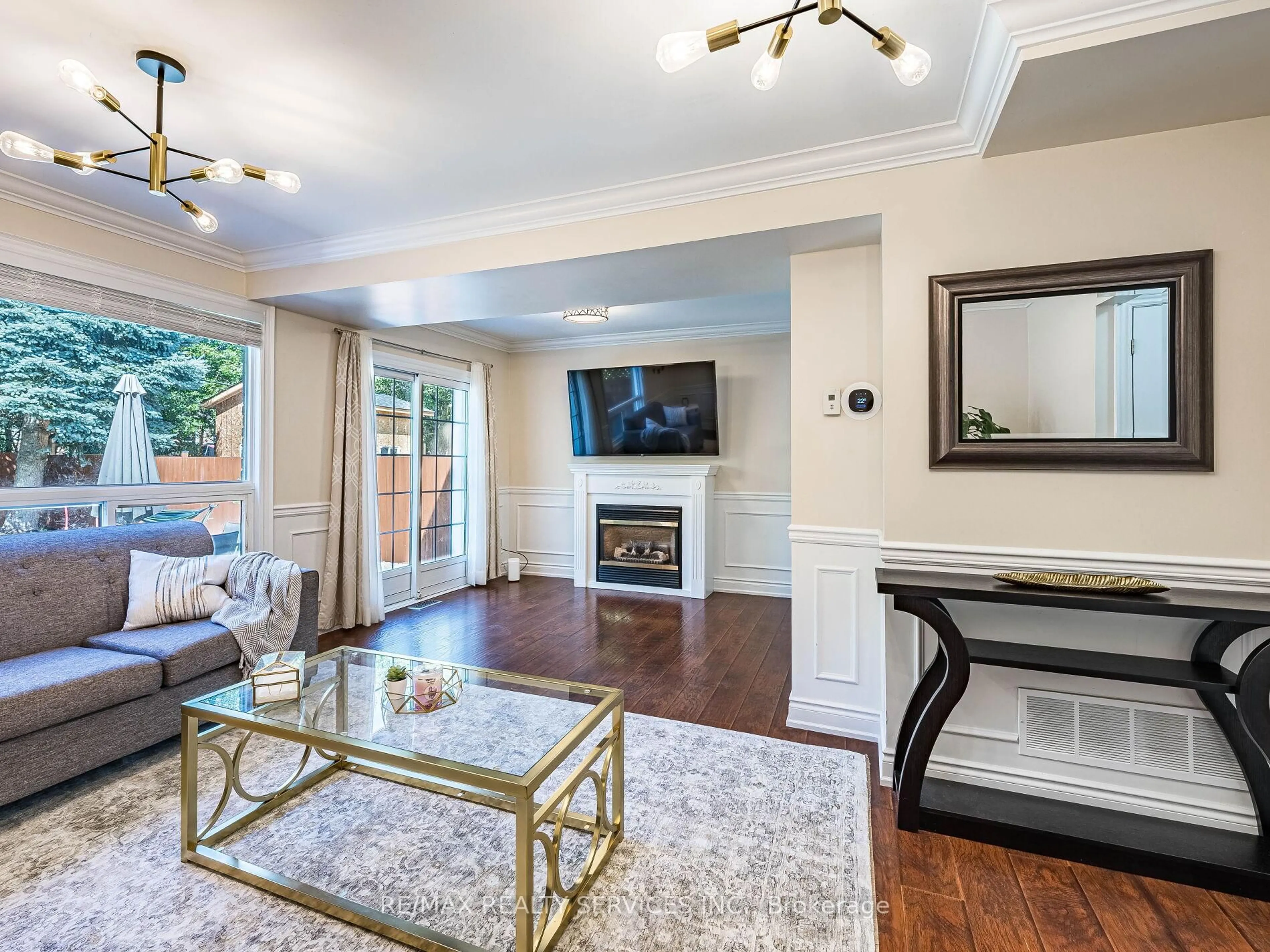 Living room with furniture, wood/laminate floor for 312 Killarney Crt, Oshawa Ontario L1J 6C7