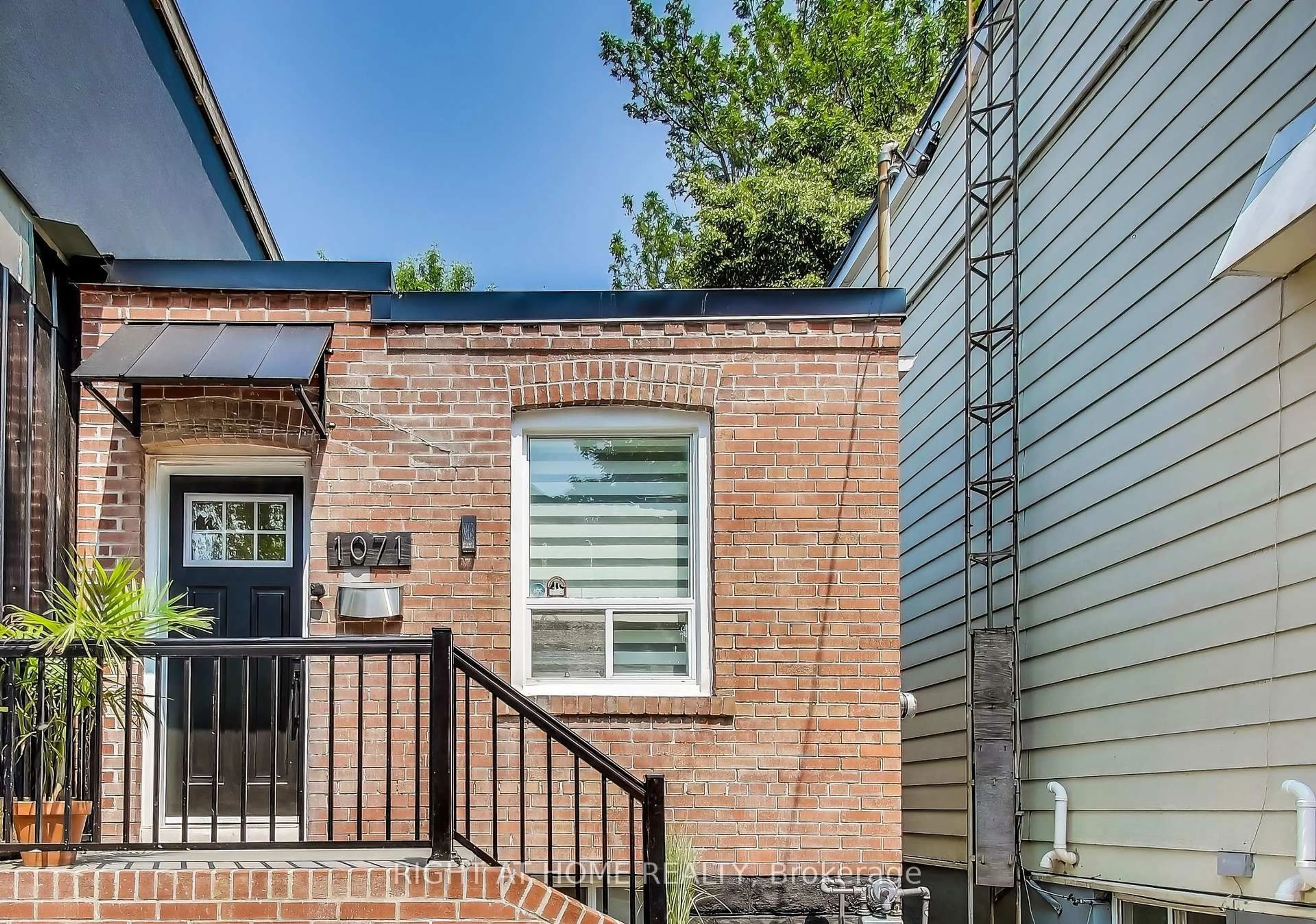 Home with brick exterior material, street for 1071 Craven Rd, Toronto Ontario M4J 4V7