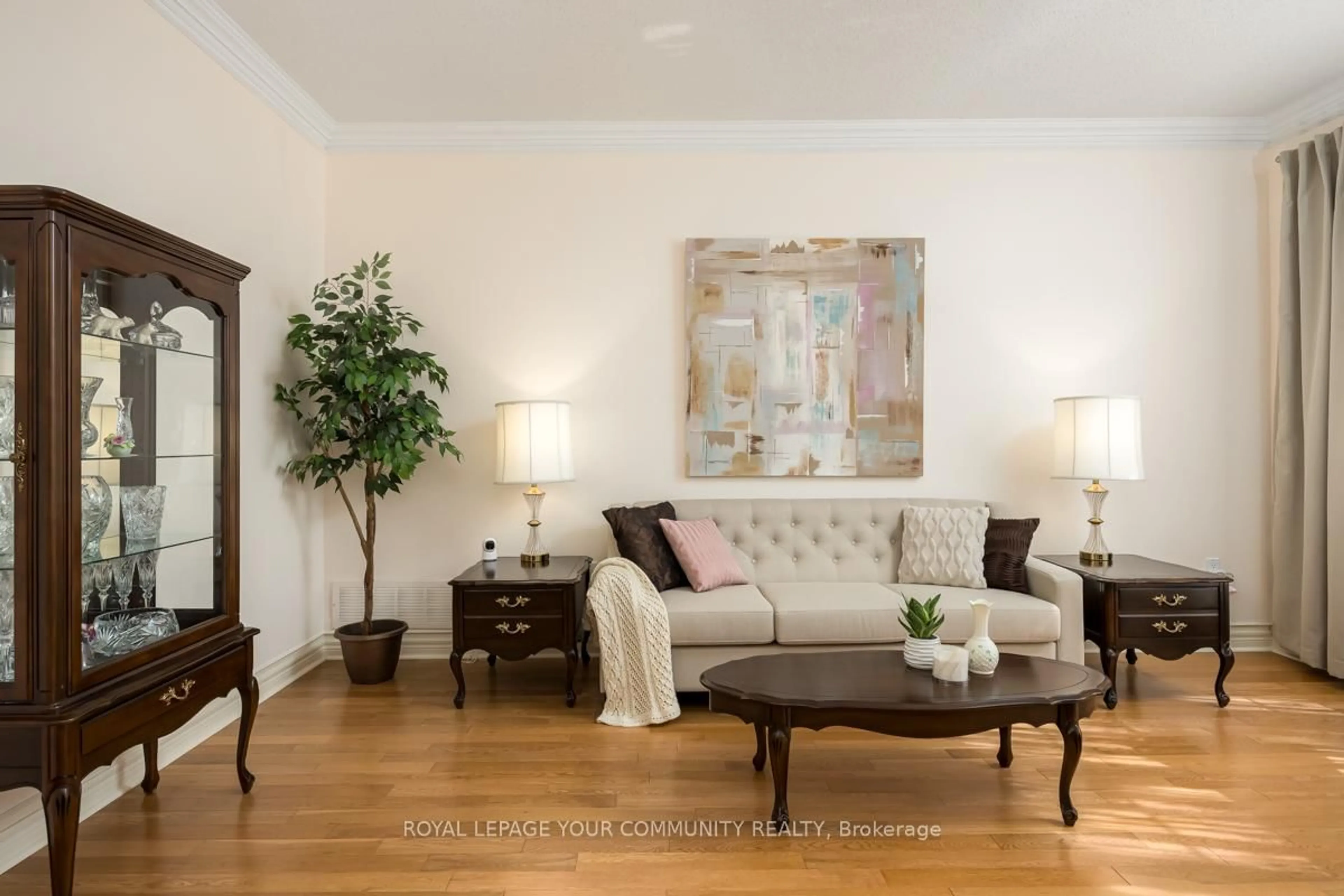 Living room with furniture, wood/laminate floor for 58 Brimwood Crt, Pickering Ontario L1V 6L1
