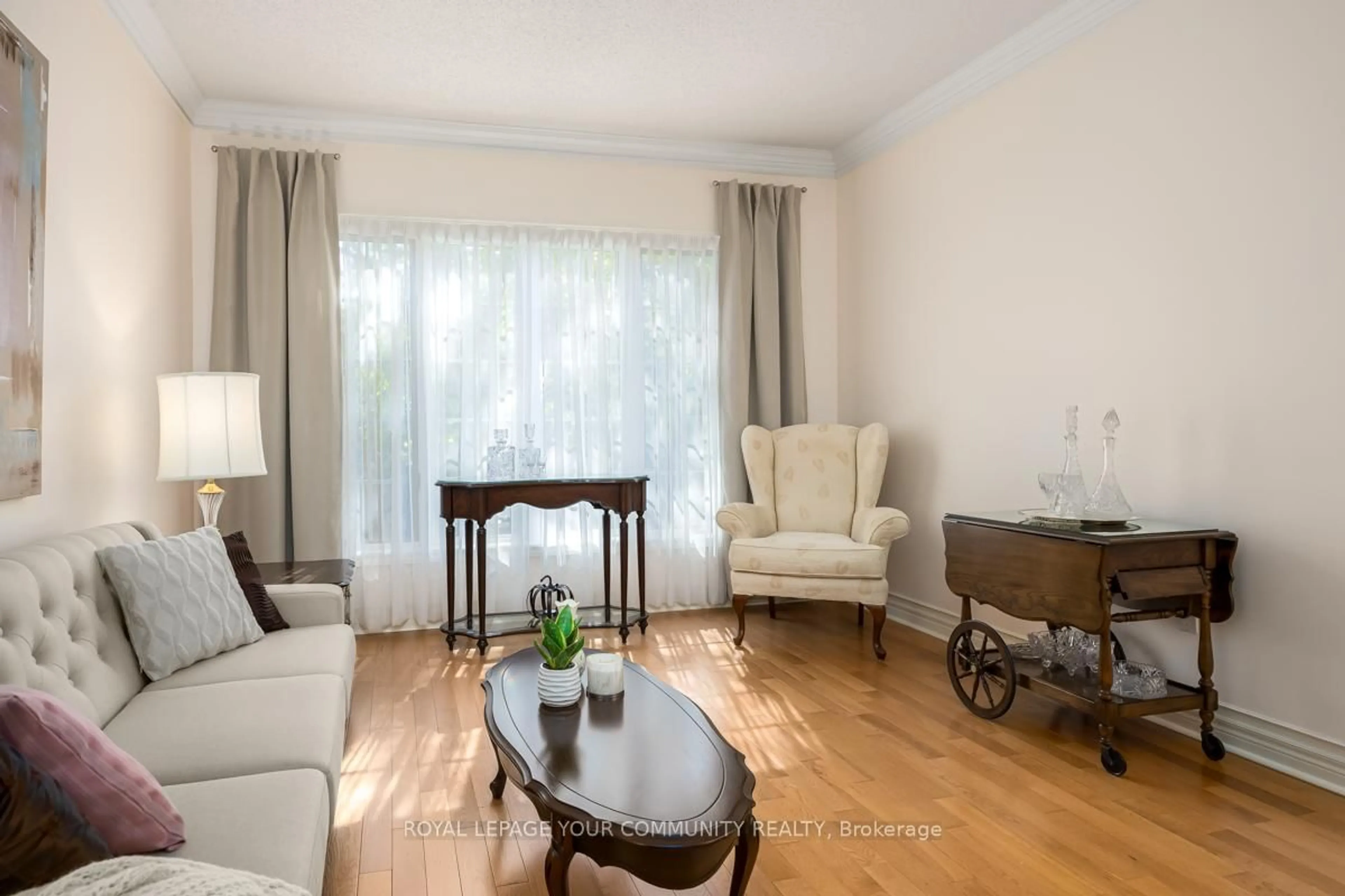 Living room with furniture, wood/laminate floor for 58 Brimwood Crt, Pickering Ontario L1V 6L1