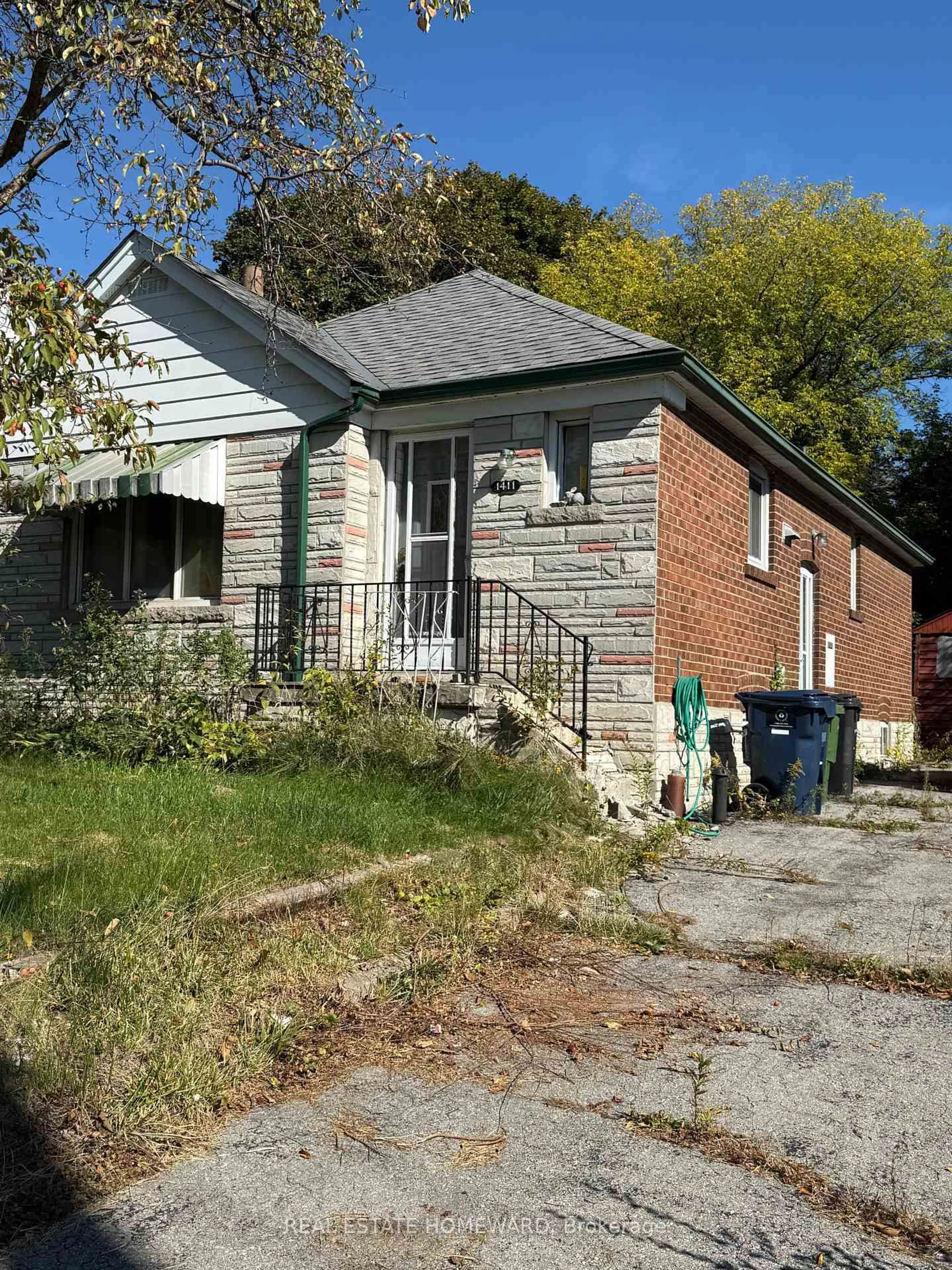 Home with brick exterior material, street for 1411 Victoria Park Ave, Toronto Ontario M4A 2L9