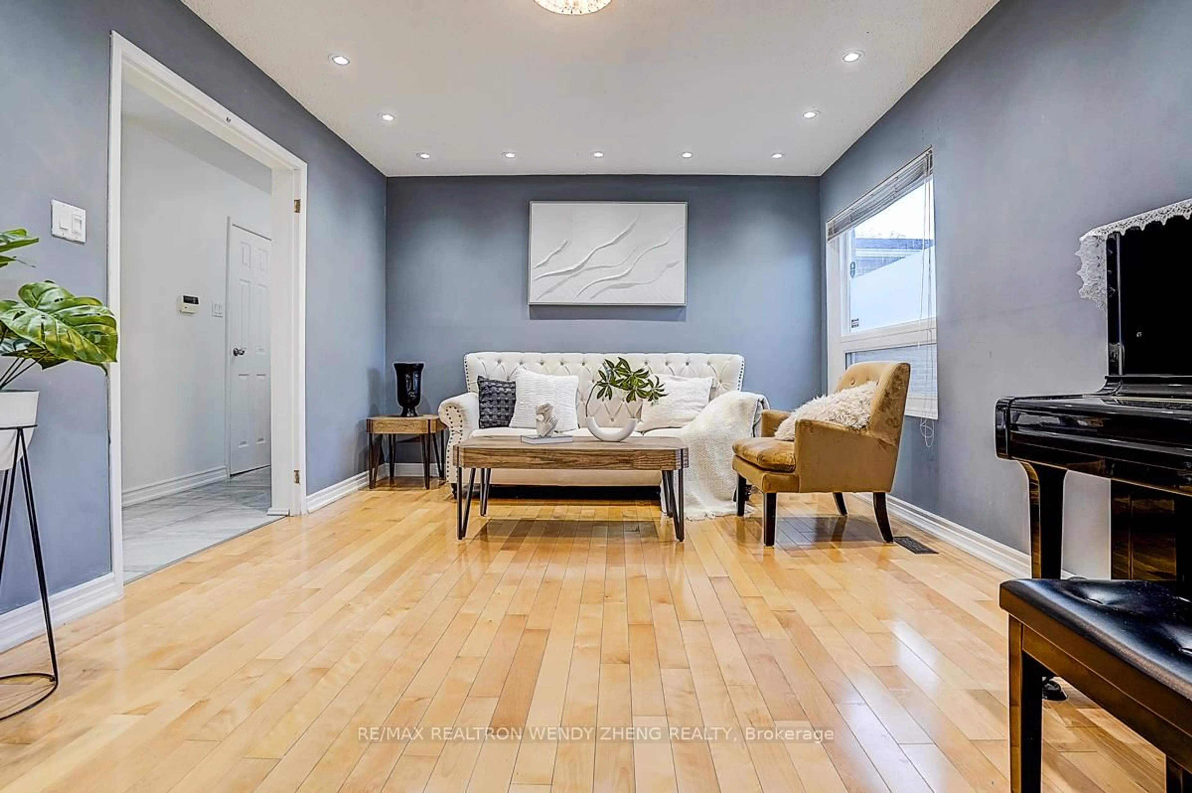 Living room with furniture, wood/laminate floor for 90 Radwell Cres, Toronto Ontario M1V 2J5
